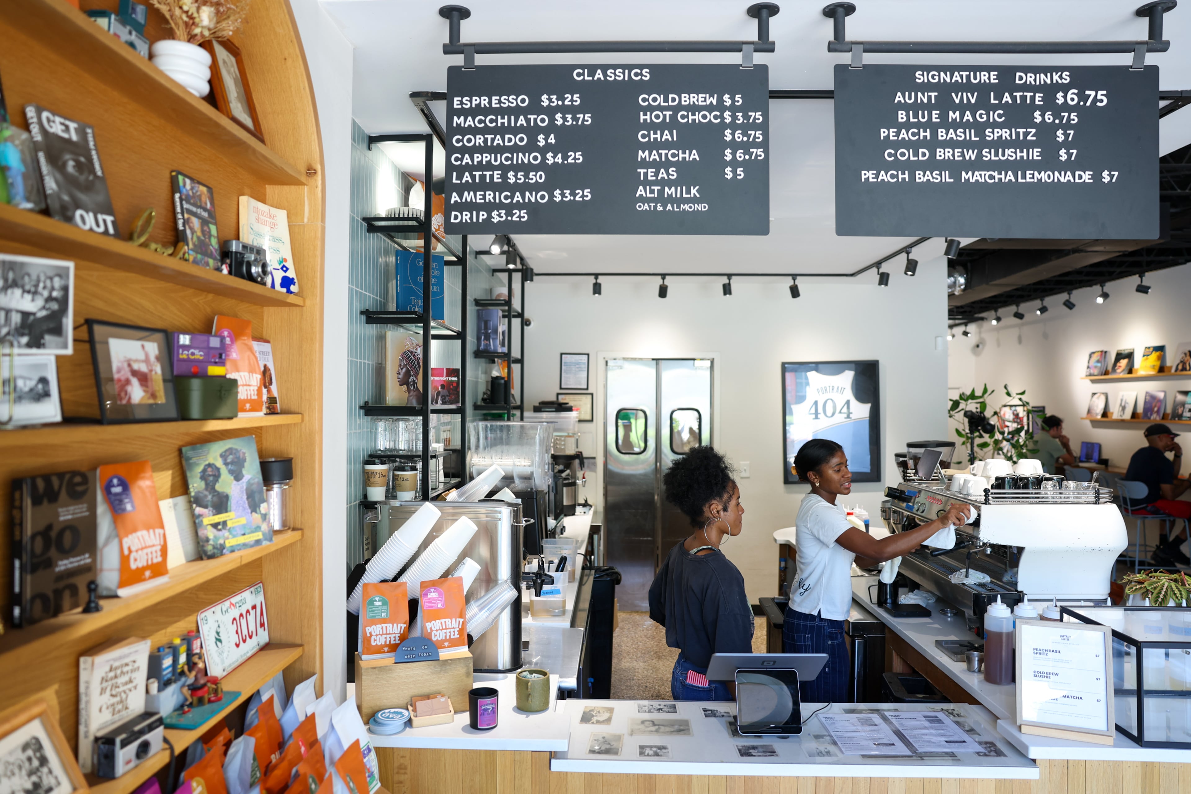 Barista Aayanna Collier (left) and general manager Jahlissa Colas work behind the counter inside Atlanta’s Portrait Coffee on Wednesday, Aug. 19, 2026. (Arvin Temkar/AJC)