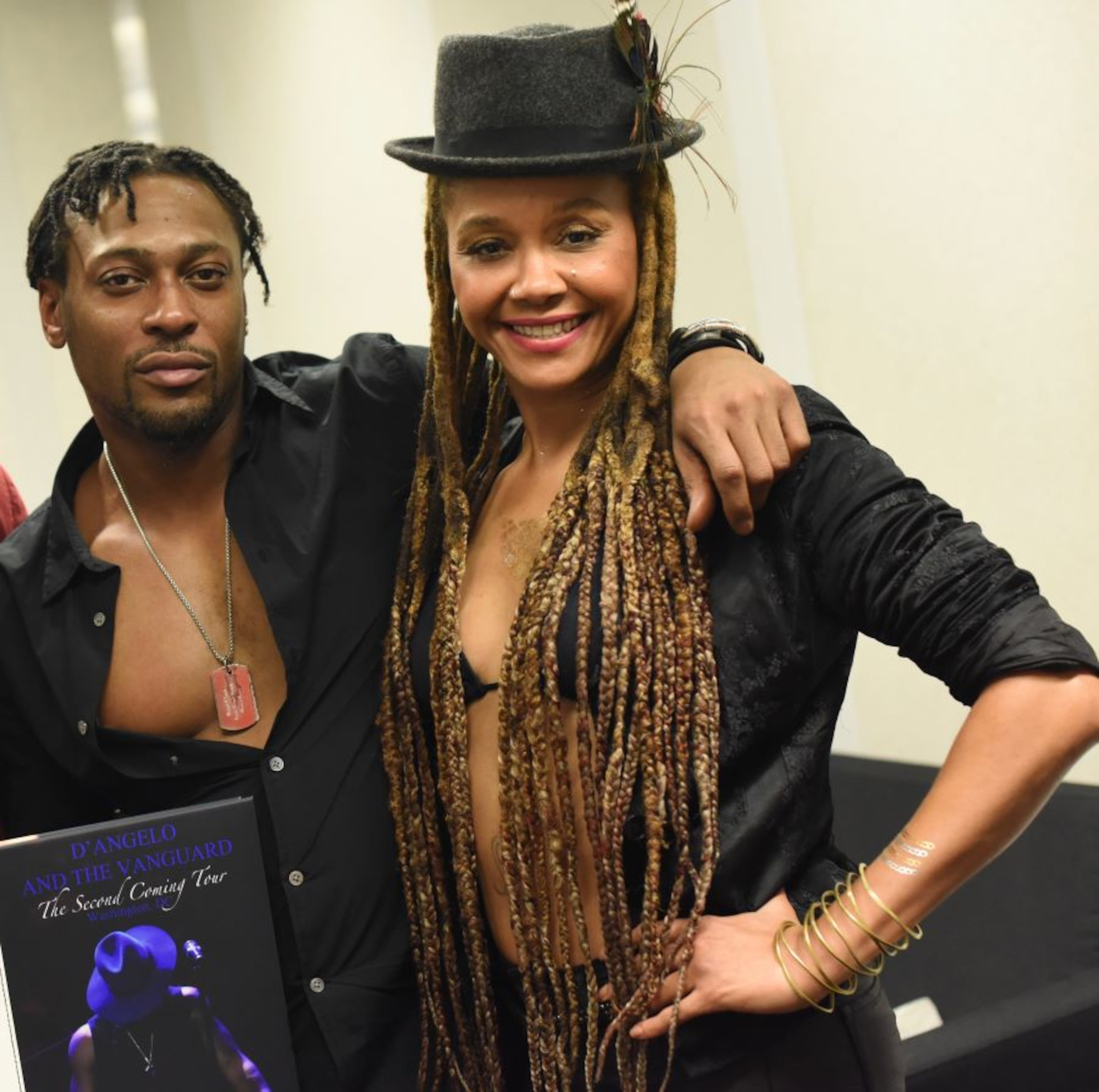 D'Angelo and singer Joi pose backstage after a stop on "The Second Coming" tour for his third album, 2014's "Black Messiah." The two were labelmates at EMI Records in the early 1990s. (Courtesy of Joi Gilliam)