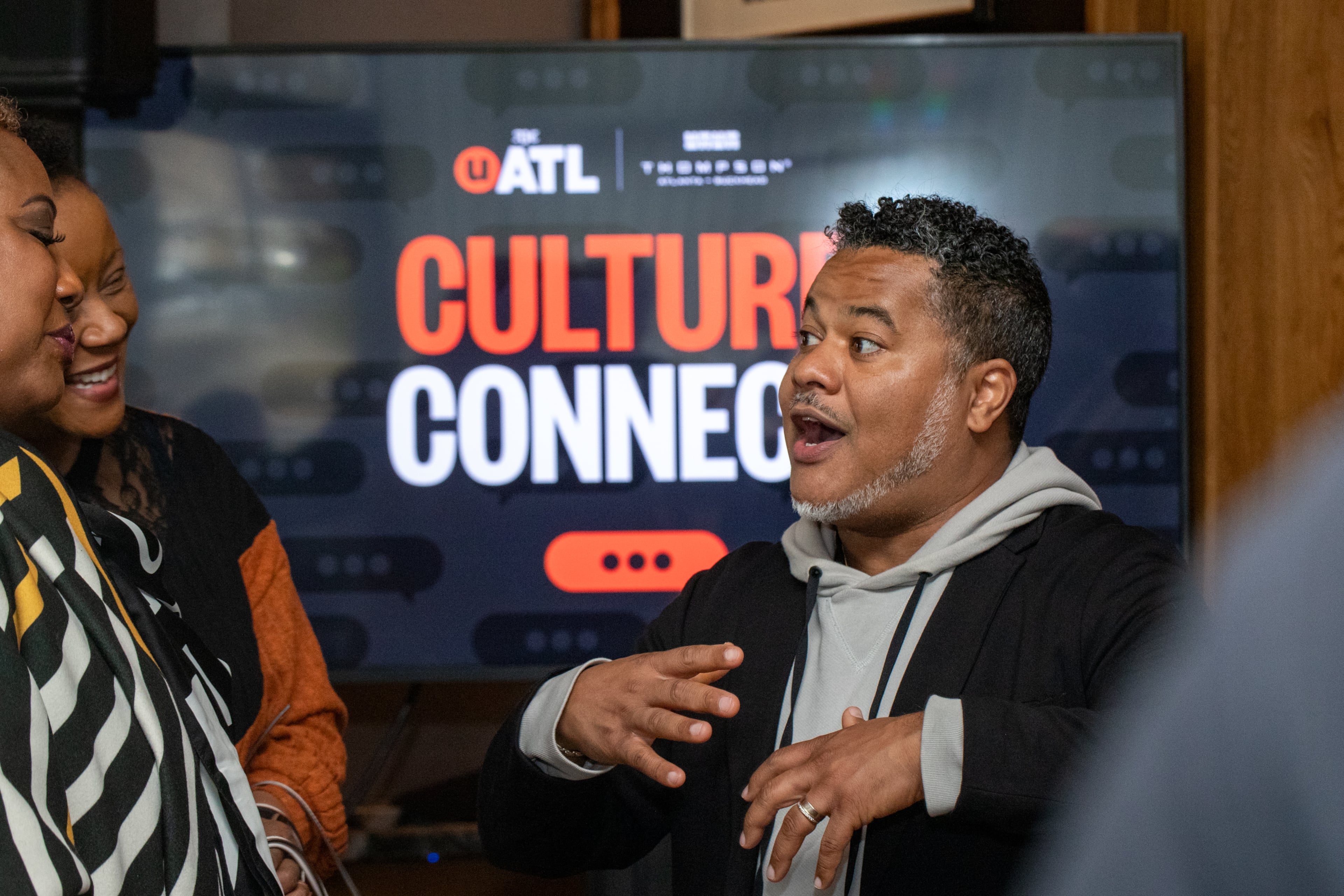 Mike Jordan (right), senior editor at the AJC, chats with attendees after the UATL’s Culture Connect panel discussion on the future of DEI and Black culture last year. (Jenni Girtman for the AJC 2024)