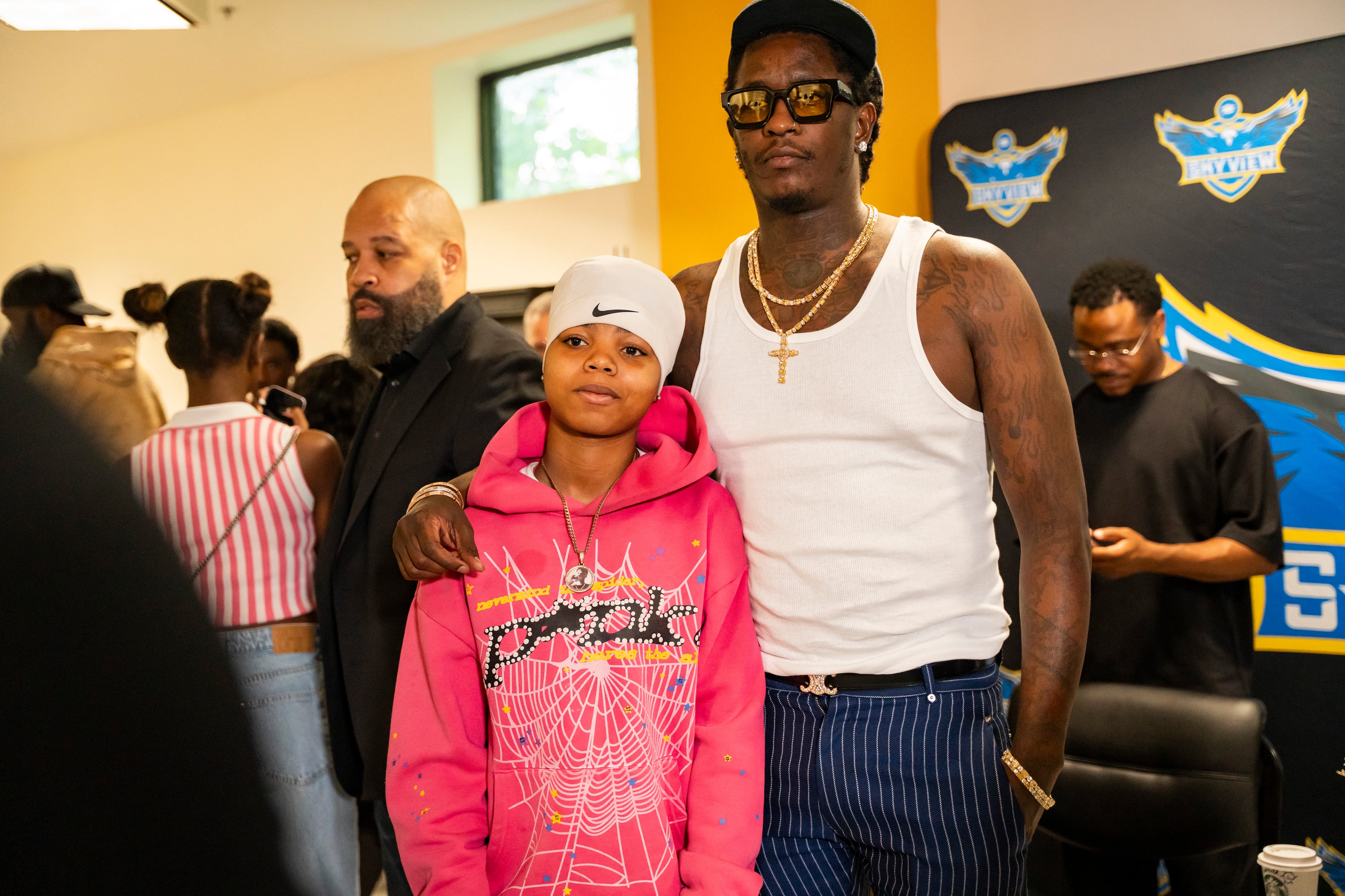 Students pose for photos alongside Young Thug following a 2025 visit to Skyview High School. The rapper says he’s focused on turning his legal troubles into teachable moments for young people. (Olivia Bowdoin for the AJC)