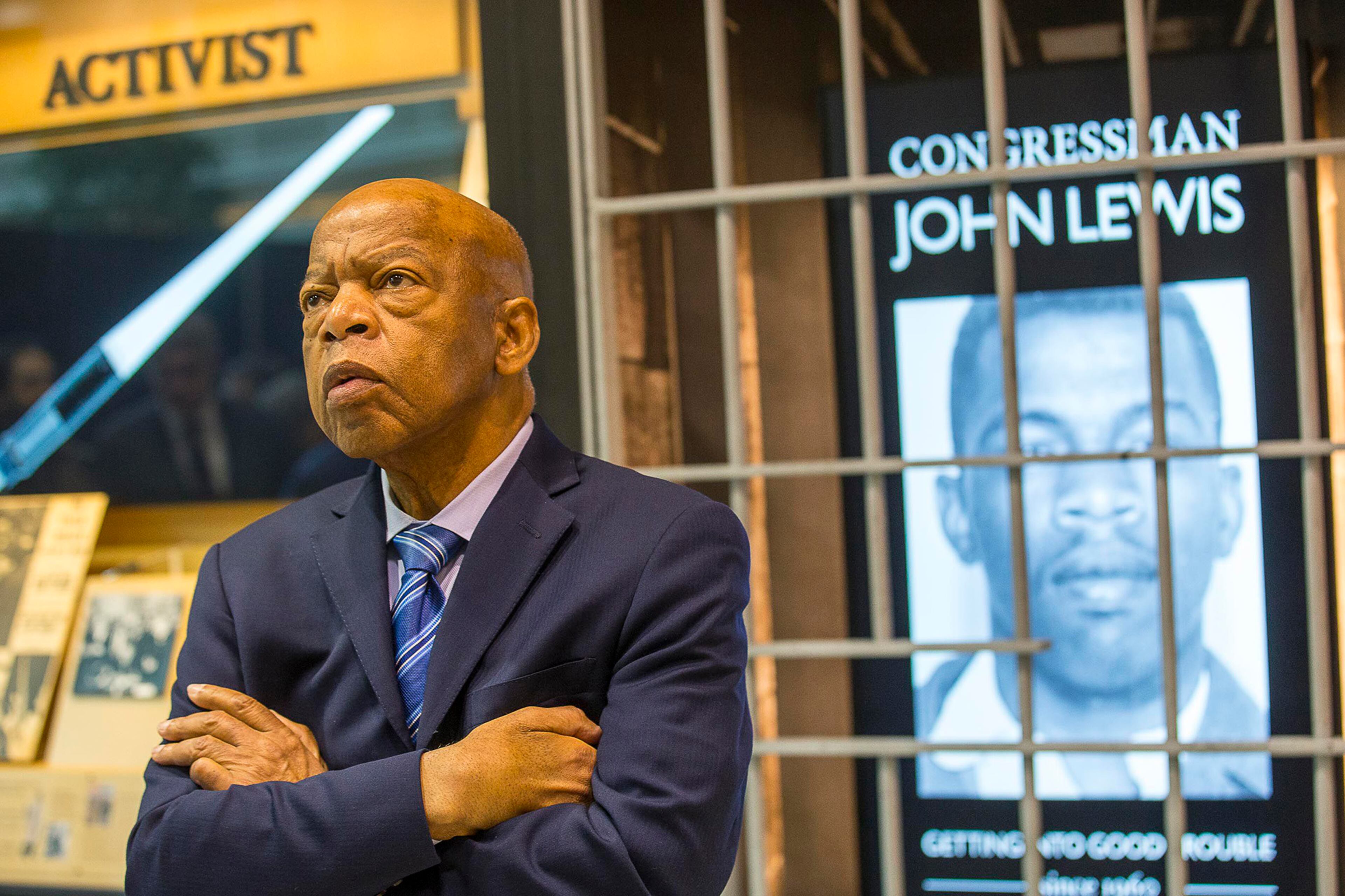 The late U.S. Congressman John Lewis, D-Ga., poses for a portrait in front of his newly unveiled art exhibit "John Lewis-Good Trouble" in the atrium of the domestic terminal at Atlanta's Hartsfield-Jackson Atlanta International Airport, on April 8, 2019. (Alyssa Pointer/AJC/TNS)