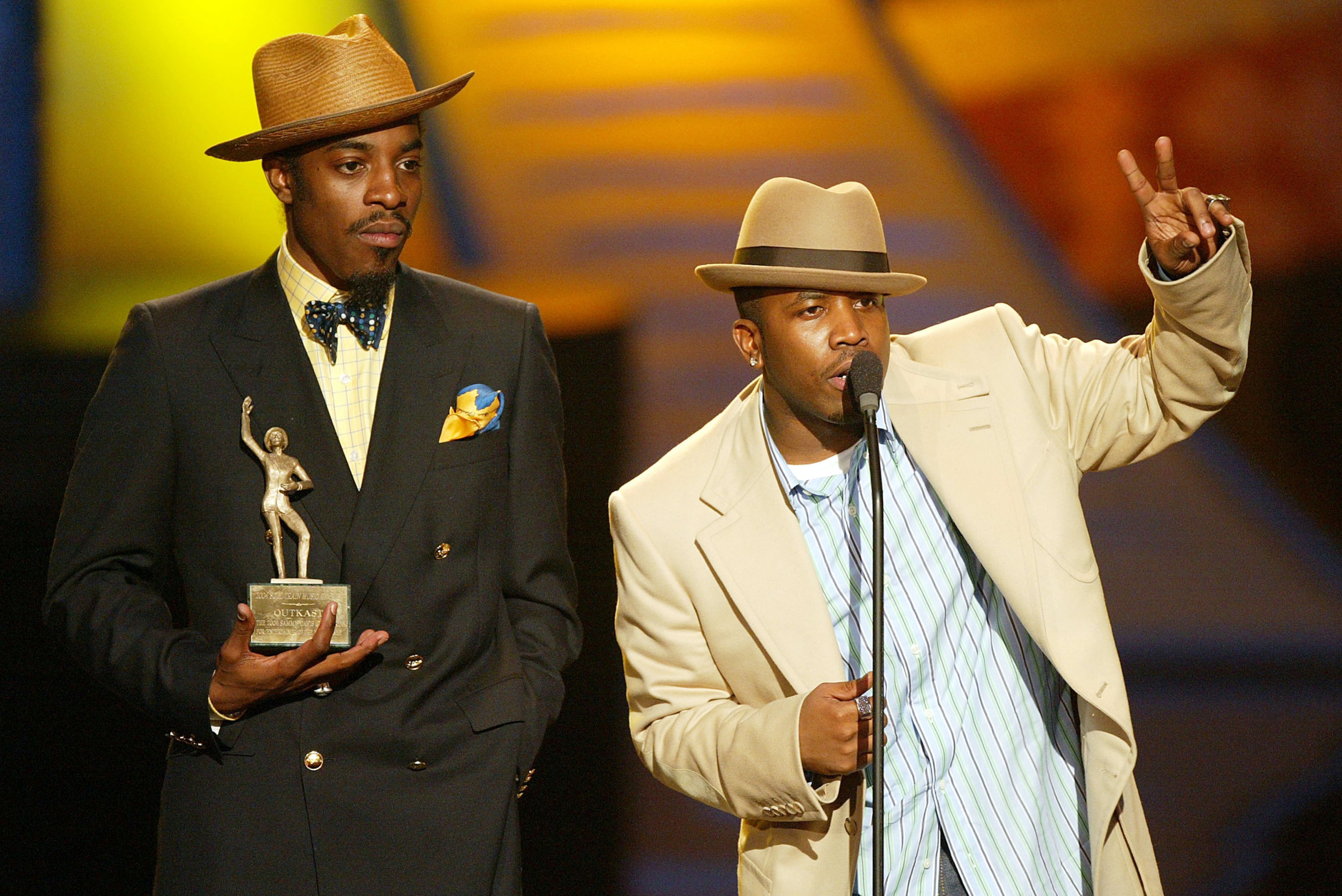Outkast's André 3000 (L) and Big Boi appears at the "18th Annual Soul Train Music Awards" at the Scottish Rite Auditorium on March 20, 2004, in Los Angeles, California. (Courtesy of Kevin Winter)
