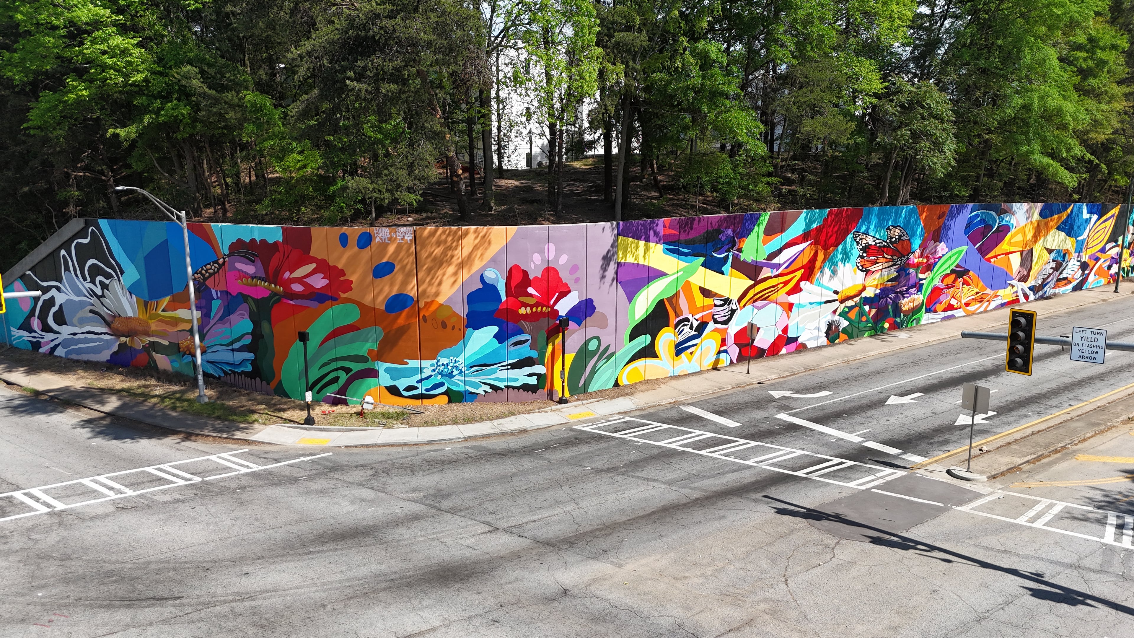 Mural "Wildseed Wildflower," in collaboration with Living Walls ATL. Charity Hamidullah is an Atlanta artist being highlighted for UATL's 404ward series, with the current focus on the performing and creative arts. (Photo by Angel Parrilla)