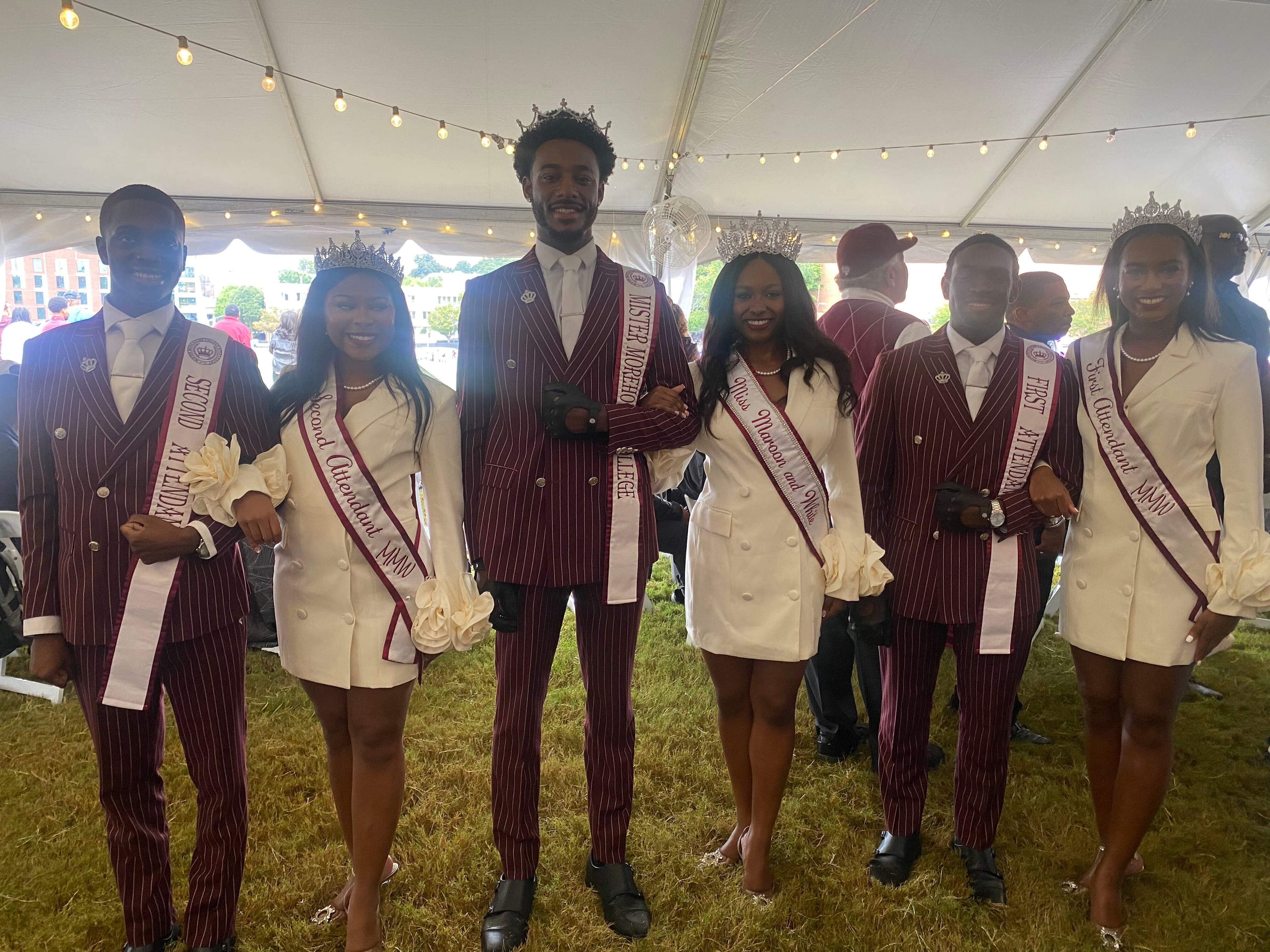 Royal courts of Mister Morehouse College and Miss Maroon and White at SpelHouse homecoming on Oct. 11, 2026. From left to right: 2nd Attendant to Mister Morehouse College Corey Lamar Smith, 2nd Attendant to Miss Maroon and White Sydney Mary-Ellen Shaw, Mister Morehouse College Amir Lamar Staten, Miss Maroon and White Genesis Divine Price, 1st Attendant to Mister Morehouse College Marlin Charles Seale IV, 1st Attendant to Miss Maroon and White Jeniyah Larrissa Joseph. (Brooke Leigh Howard/AJC)
