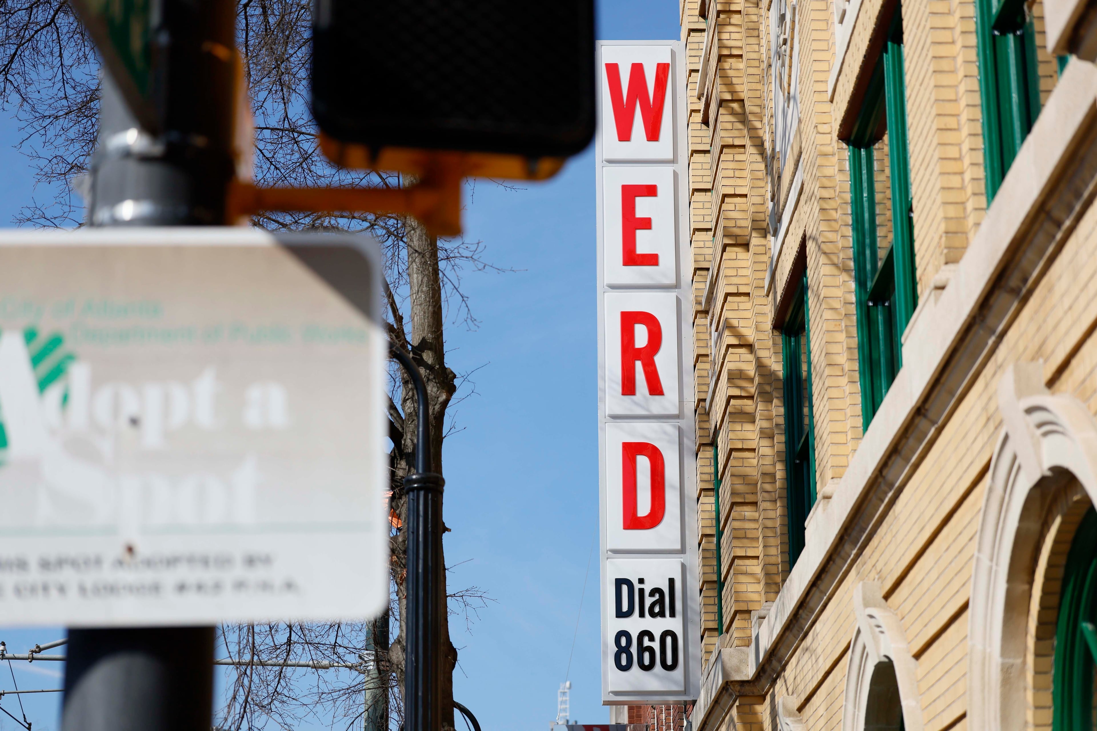 Outside the building, the signs that once adorned it can still be seen. (Miguel Martinez/AJC)