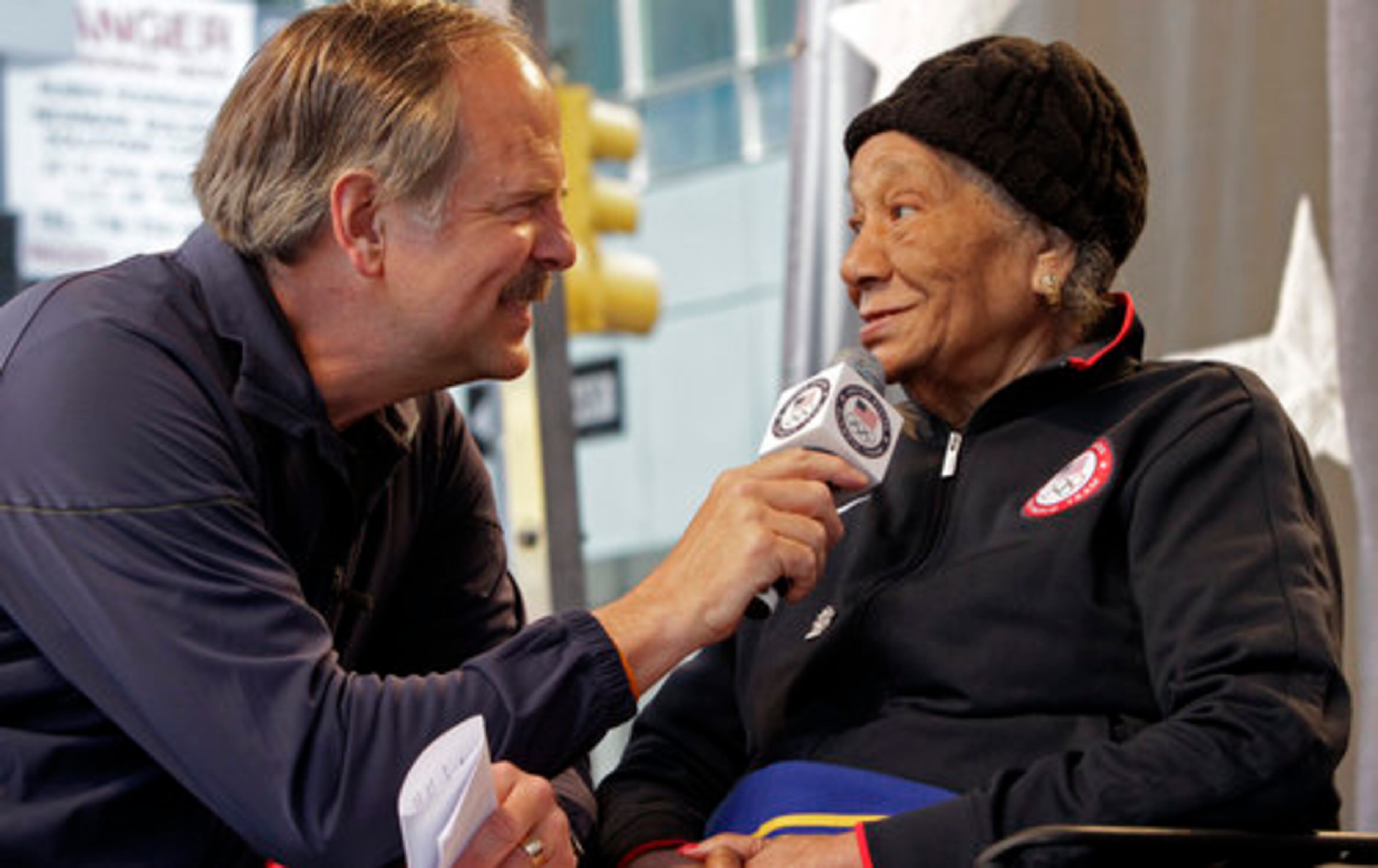 Georgia's Alice Coachman Davis (right), who won became the first Black woman to win an Olympic gold medal after winning the high jump at the 1948 Games, is interviewed in New York in 2012. (Bebeto Matthews/AP 2012)
