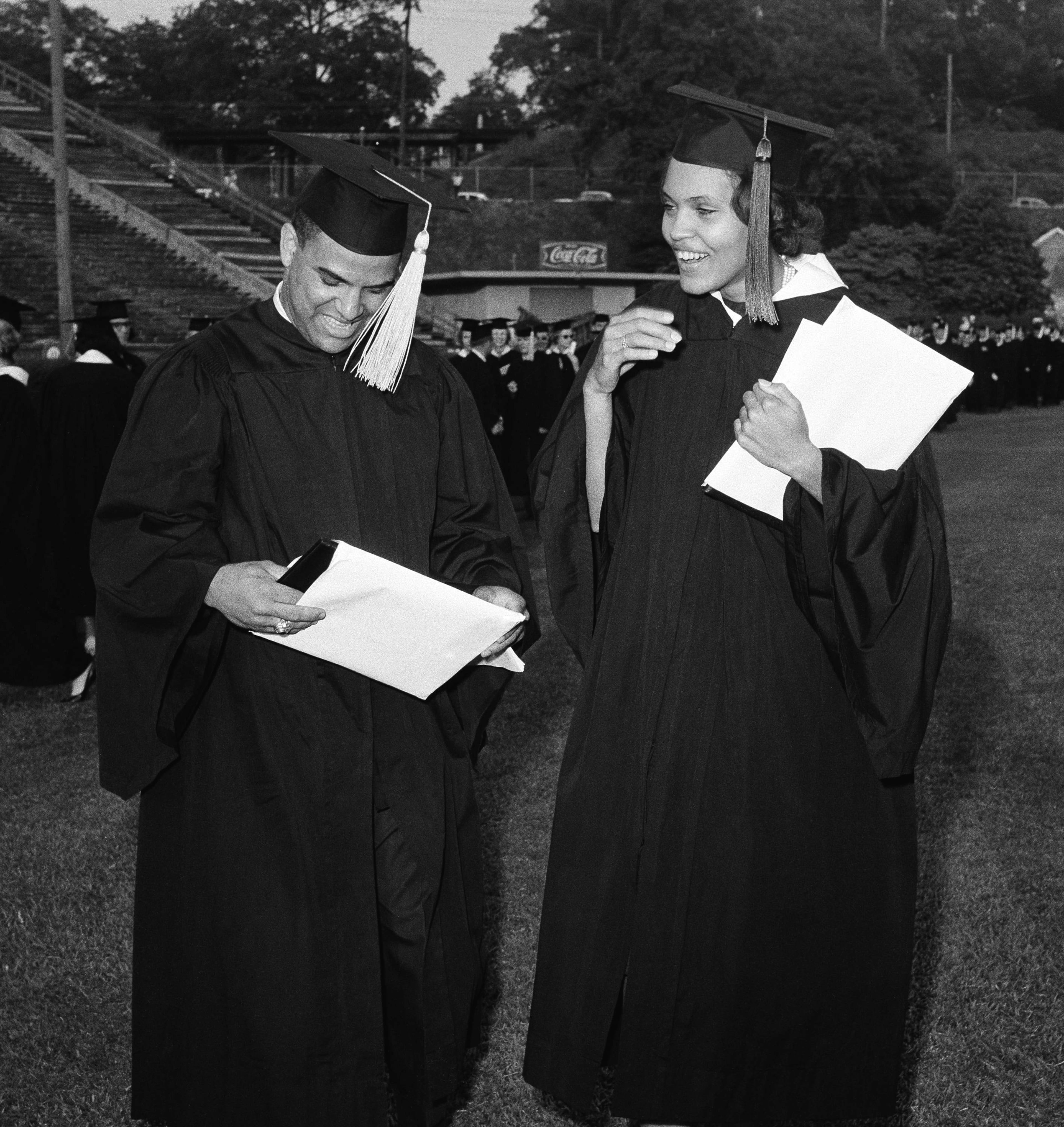 Hamilton Holmes and Charlayne Hunter of Atlanta examine diplomas awarded during the University of Georgia's 160th commencement in Athens, June 3, 1963. They are the first black students to attend the nation's oldest land grant college. (AP file photo)