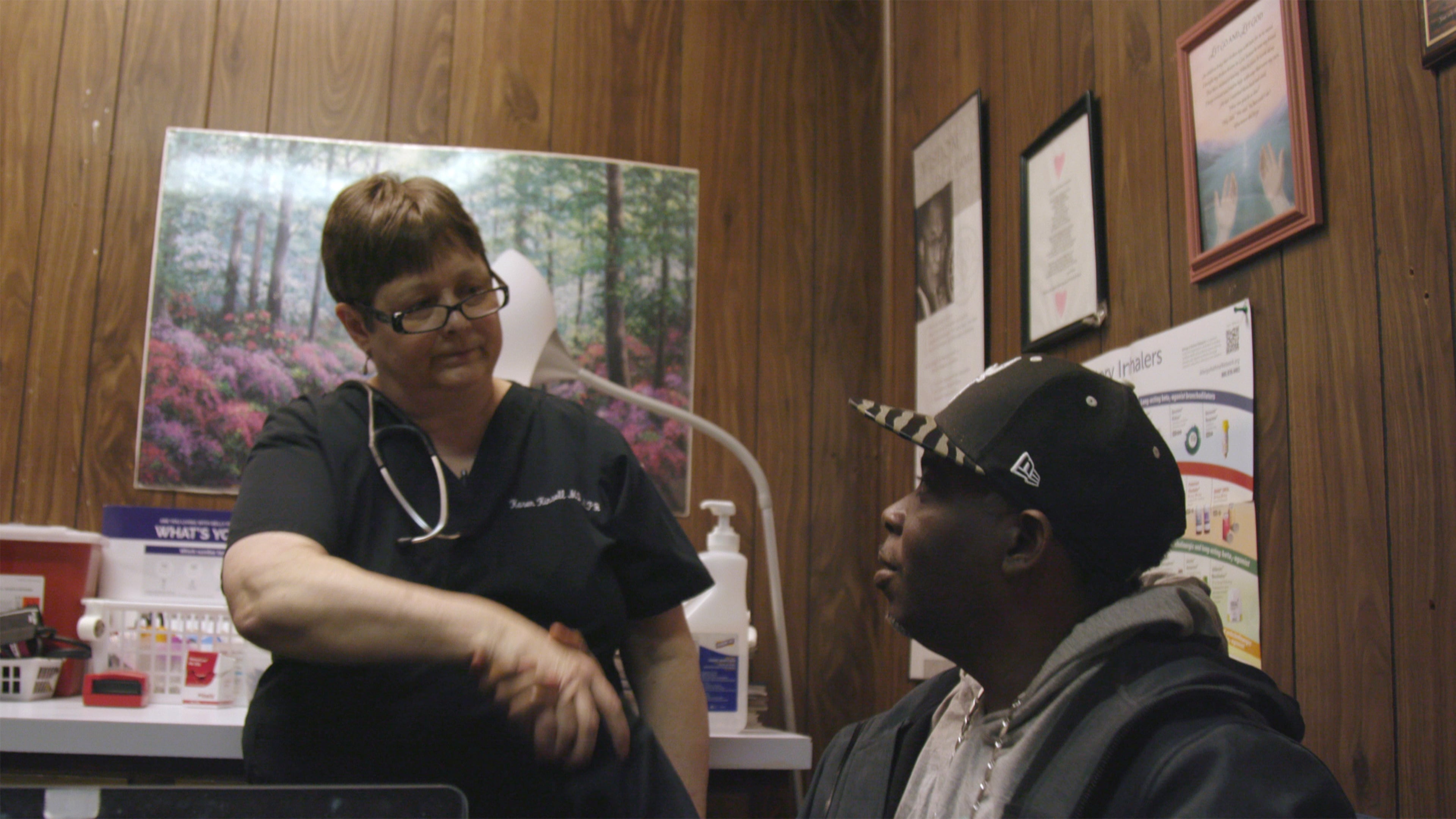 Dr. Karen Kinsell shakes the hand of Calvin Duncan after a positive appointment. Kinsell has been the only physician in Clay County for more than a decade. (Courtesy of Reel South)
