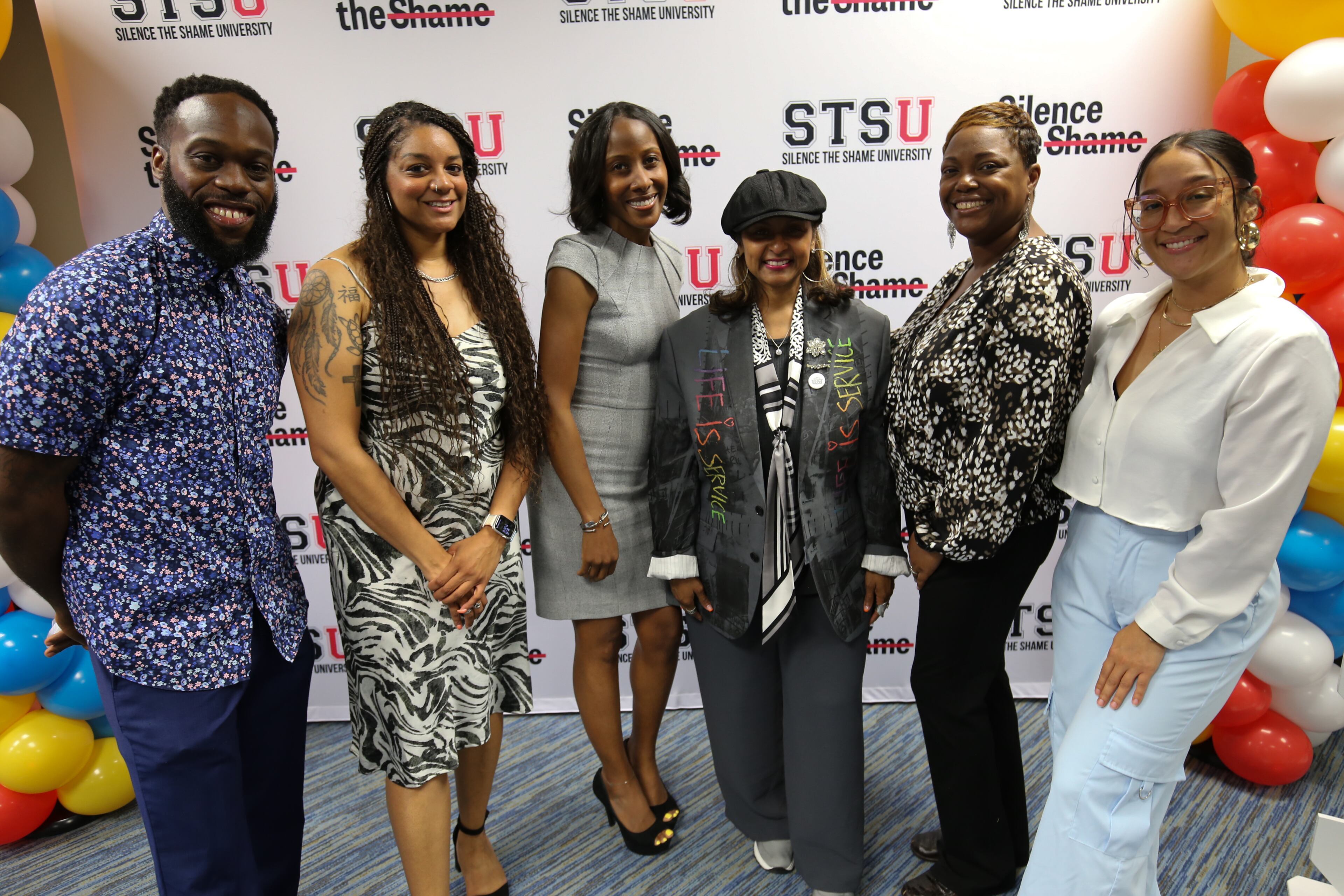 Silence the Shame staffers Nick Farthing (from left), Chonniea Bullock, Sonya Jones, Shanti Das, Jewell Gooding and Maegan-Charjoi Pringle at the graduation ceremony for Silence the Shame University. (Courtesy Silence the Shame)