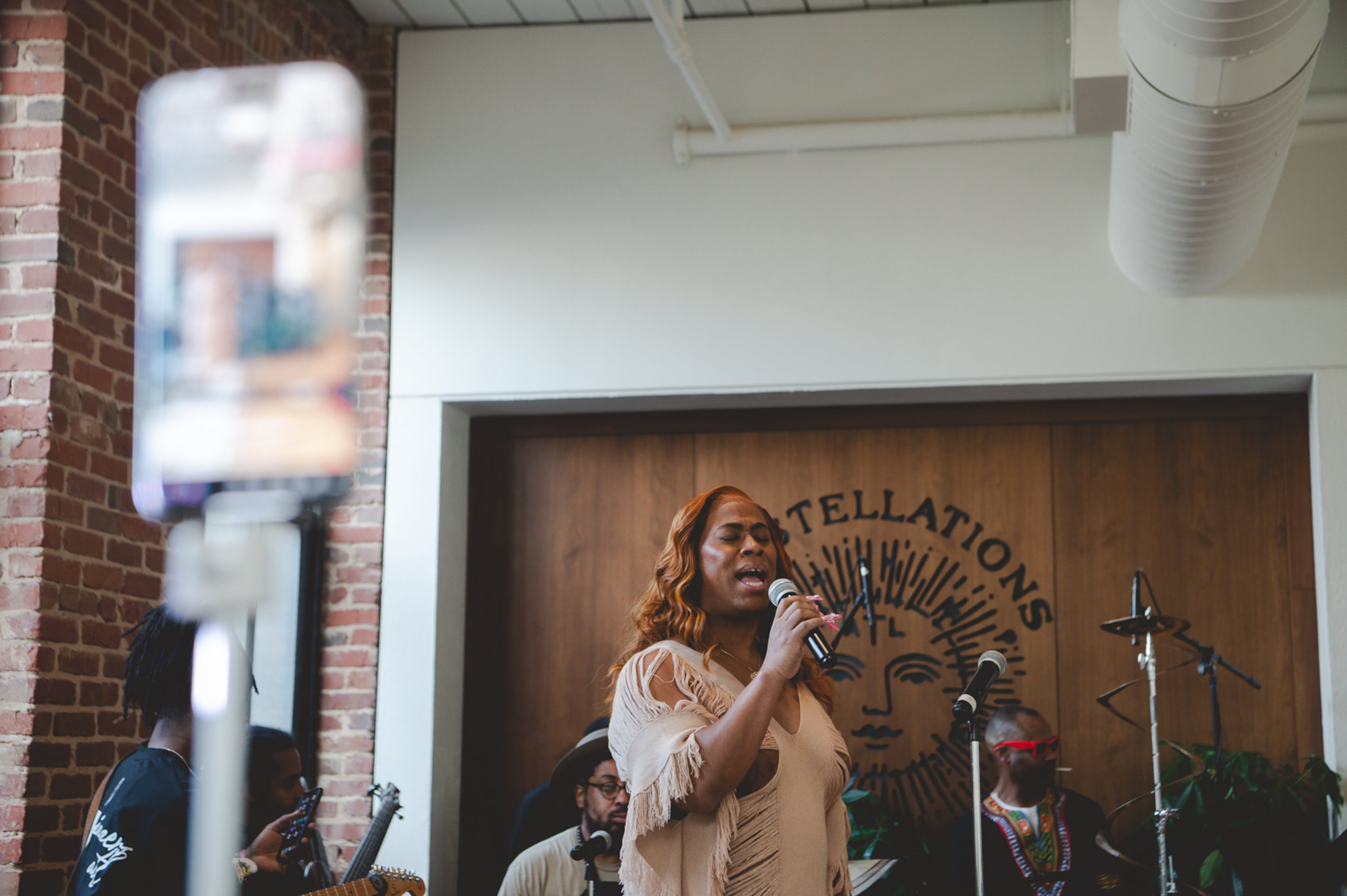 Dominique Morgan sings at SisterSong Women of Color Reproductive Justice Collective's “For the Love of Culture Vol. 1” on Saturday, Sept. 20, 2025, at Constellations ATL in Sweet Auburn. (Courtesy of SisterSong)