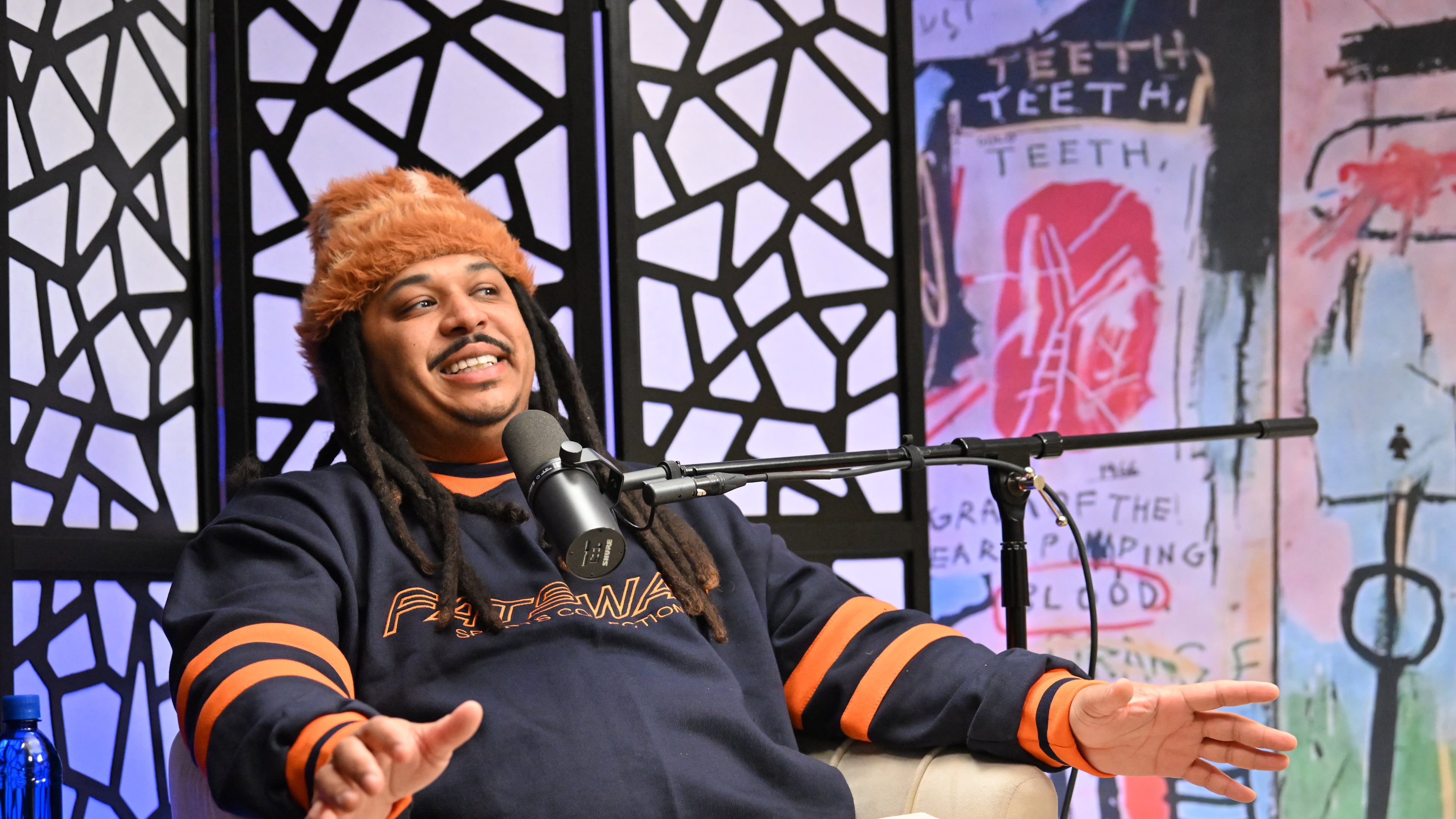 Podcaster Deante' Kyle, who grew up in Douglasville, records "Grits & Eggs" with rapper LaRussell in his recording studio Saturday, Jan. 31, 2026, in Atlanta. (Hyosub Shin/AJC)