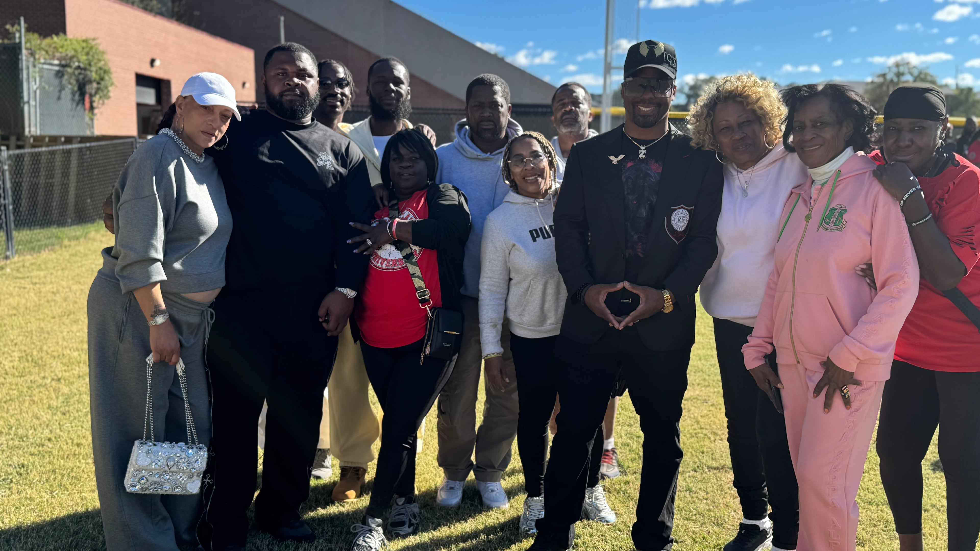 Family and friends from Philadelphia attend Clark Atlanta University homecoming on Oct. 17, 2026, to celebrate Zimier "Tyson" McCloud as one of the 17 inductees to the school's 2026-27 Athletics Hall of Fame Class. McCloud, who graduated in 2011, played on the defensive line for CAU's football team and said being a star athlete isn't just about sports. "Sports is a bonus, but they care about what you do off the court," he said. (Brooke Leigh Howard/AJC)