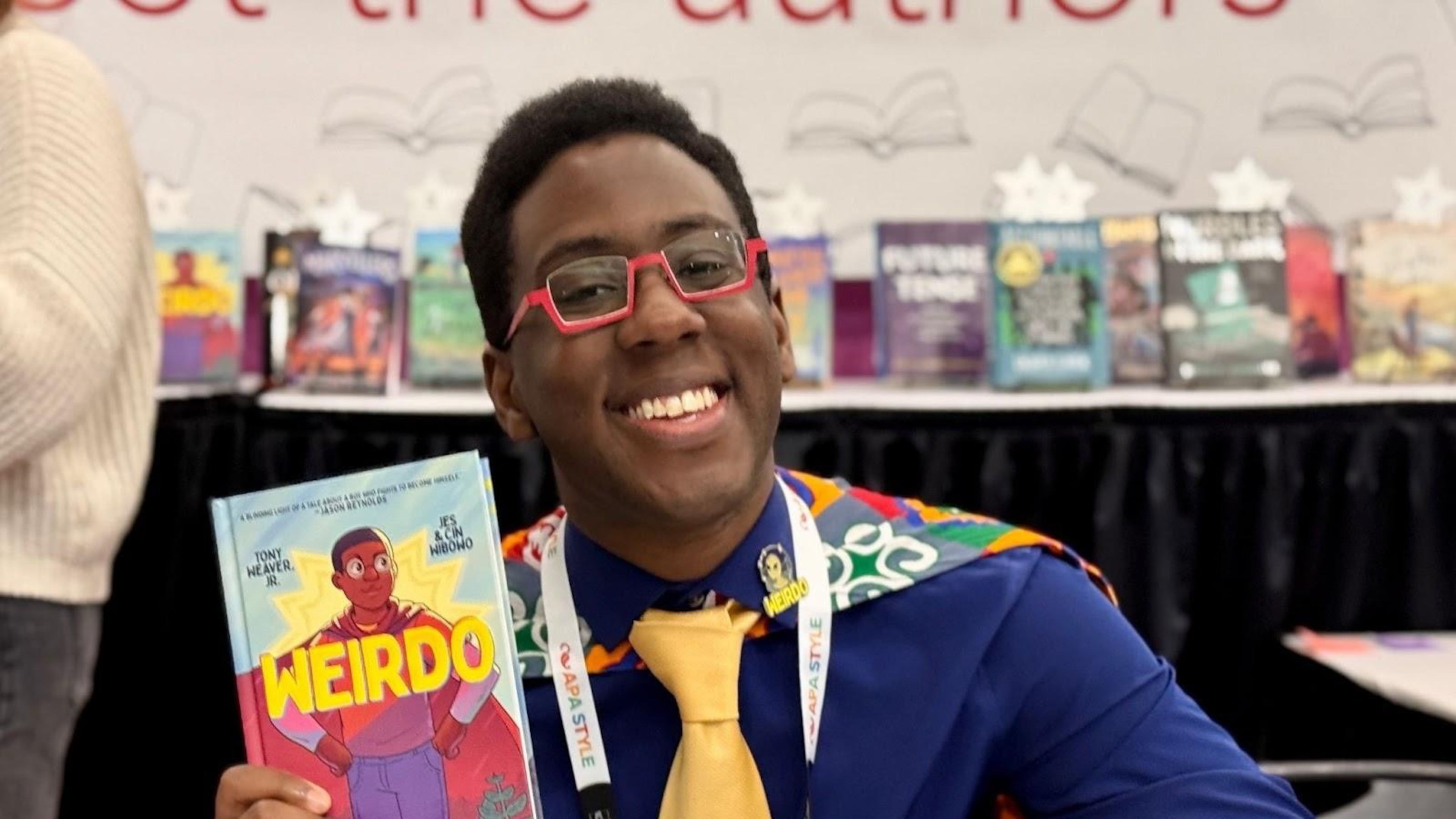 Nerds for Literacy Founder Tony Weaver Jr. poses with his graphic memoir, "Weirdo." (Courtesy of Tony Weaver Jr.)