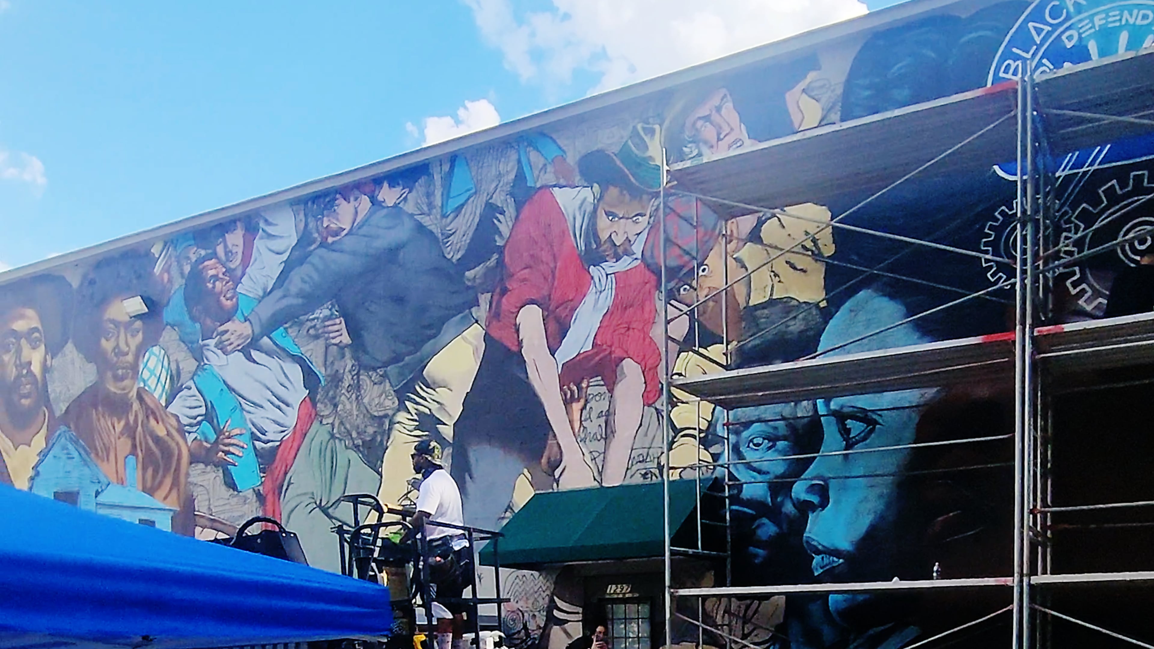 Although some south Atlanta residents see the 1906 Atlanta Race Massacre mural as history and education, others say it is the wrong image for their community. (Courtesy of the National Center of Civil and Human Rights)