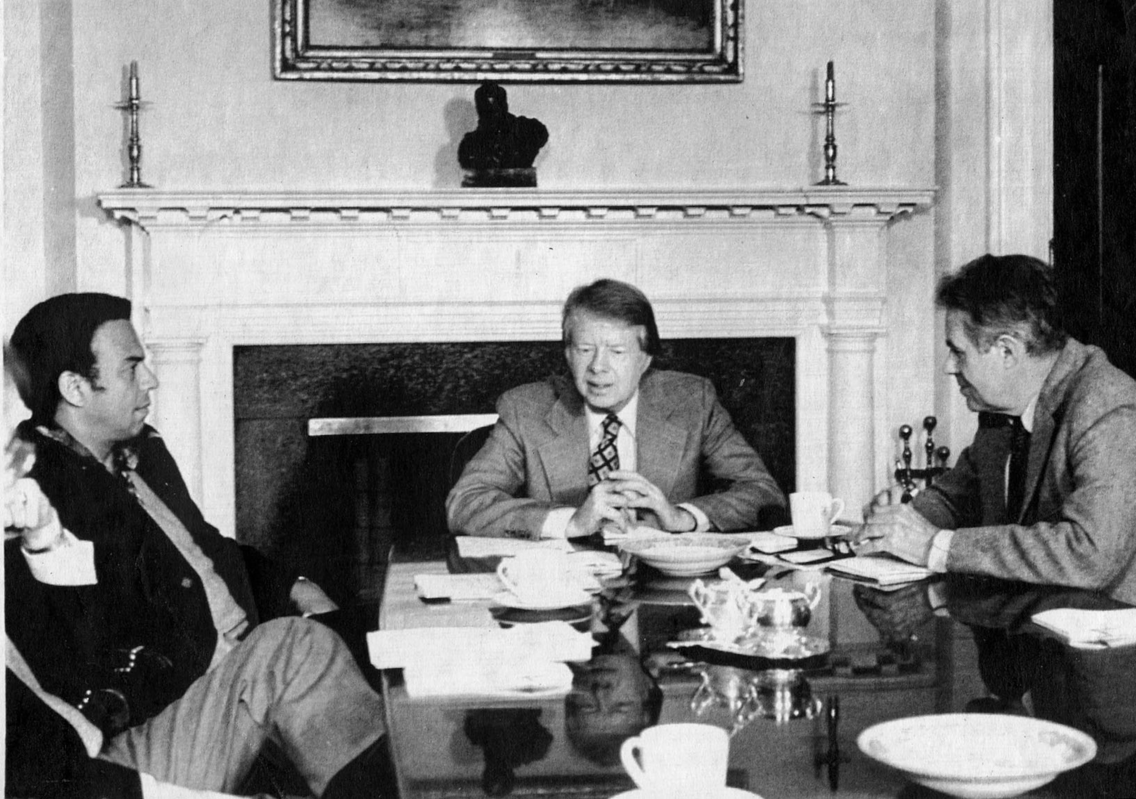 One hundred days into his term, President Jimmy Carter conferred with Ambassador Andrew Young (left) and U.S. Secretary of State Cyrus Vance at the White House on April 30, 1977. (File/UPI)