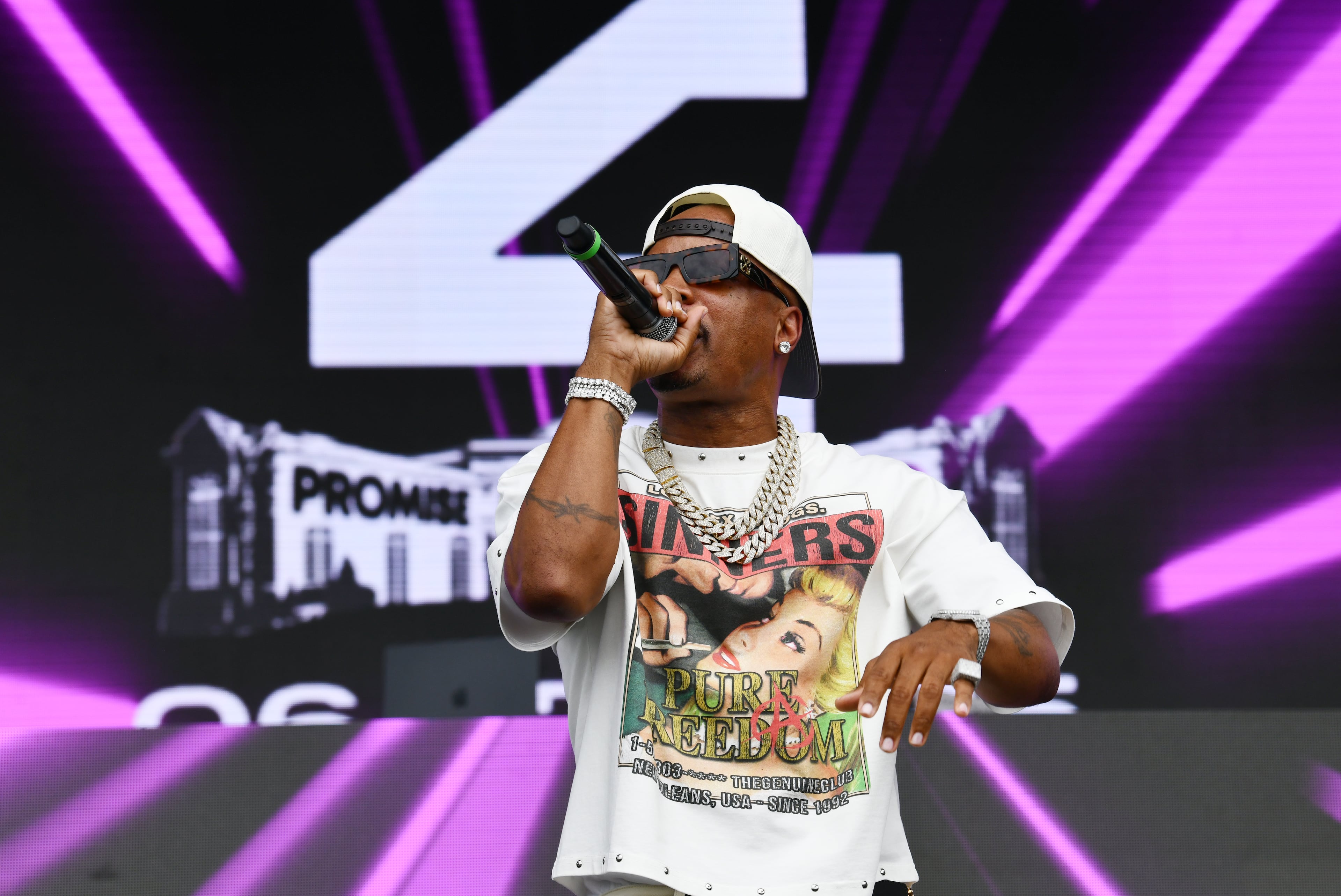 Nino Breeze performs during the fourth annual Rick Ross Car Show on Saturday in Fayetteville. Stage performances included Breeze, Plies and Ross himself. (Hyosub Shin/AJC)