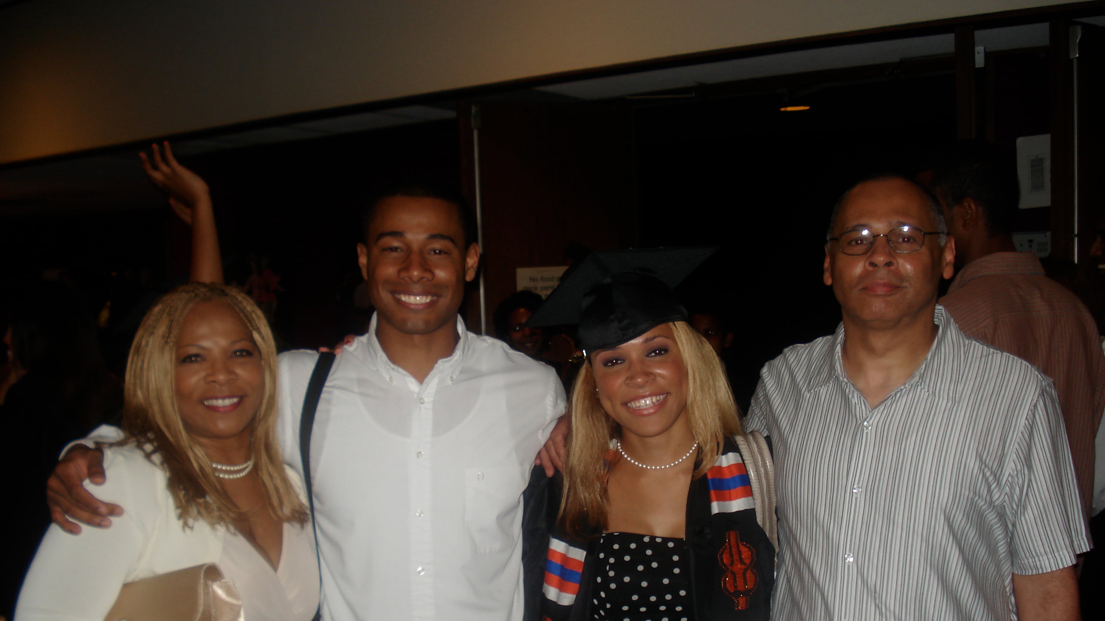 UATL reporter Brooke Leigh Howard (center) stands with her mother, brother and father following the Donning of the Kente ceremony for Black students at the University of Virginia, 2010. (Courtesy of Brooke Leigh Howard)