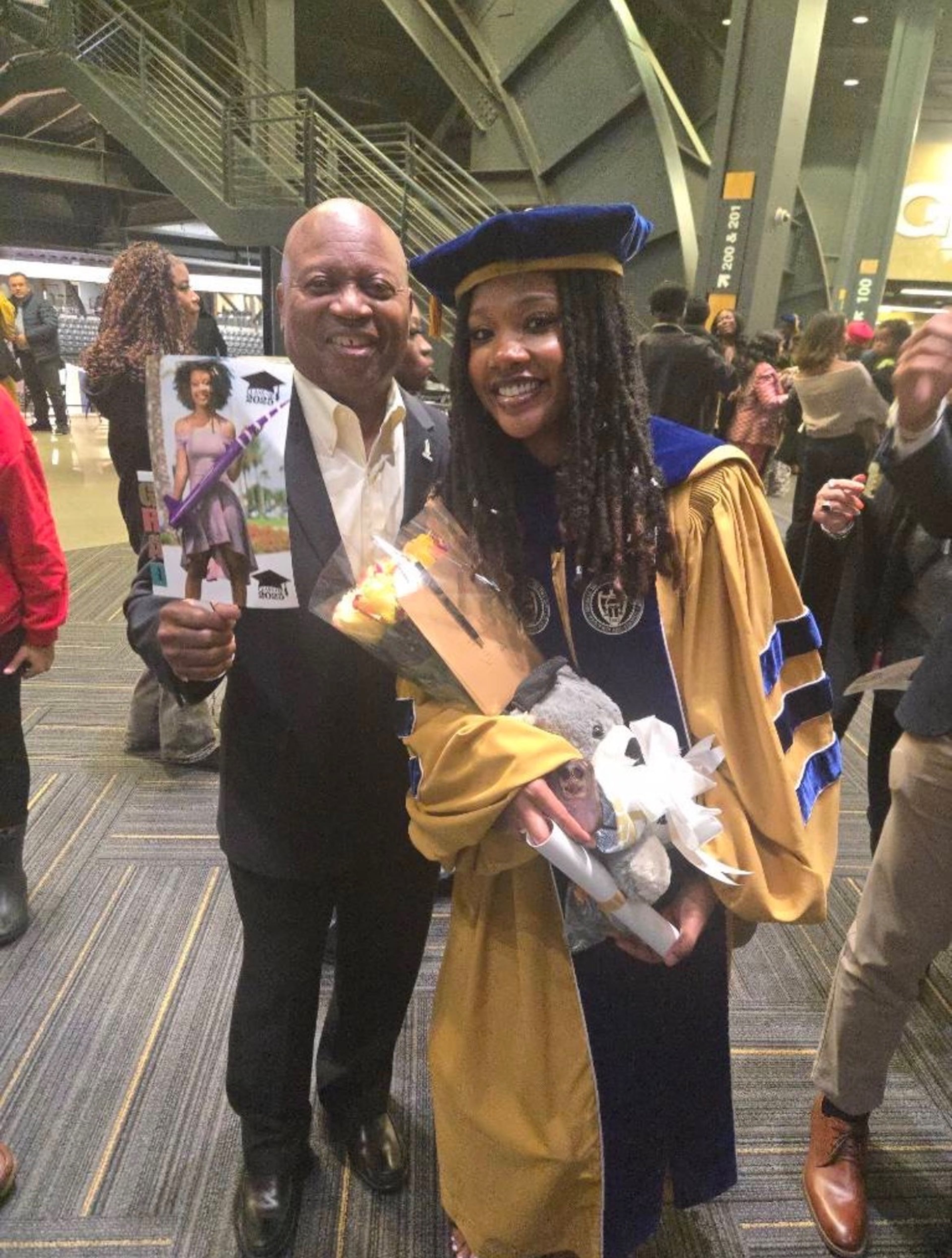 Naia Butler-Craig (right) and Carl McNair, brother of the late astronaut Ronald McNair, at Butler-Craig's December graduation from Georgia Tech, where she earned her doctorate. (Courtesy of Naia Butler-Craig)
