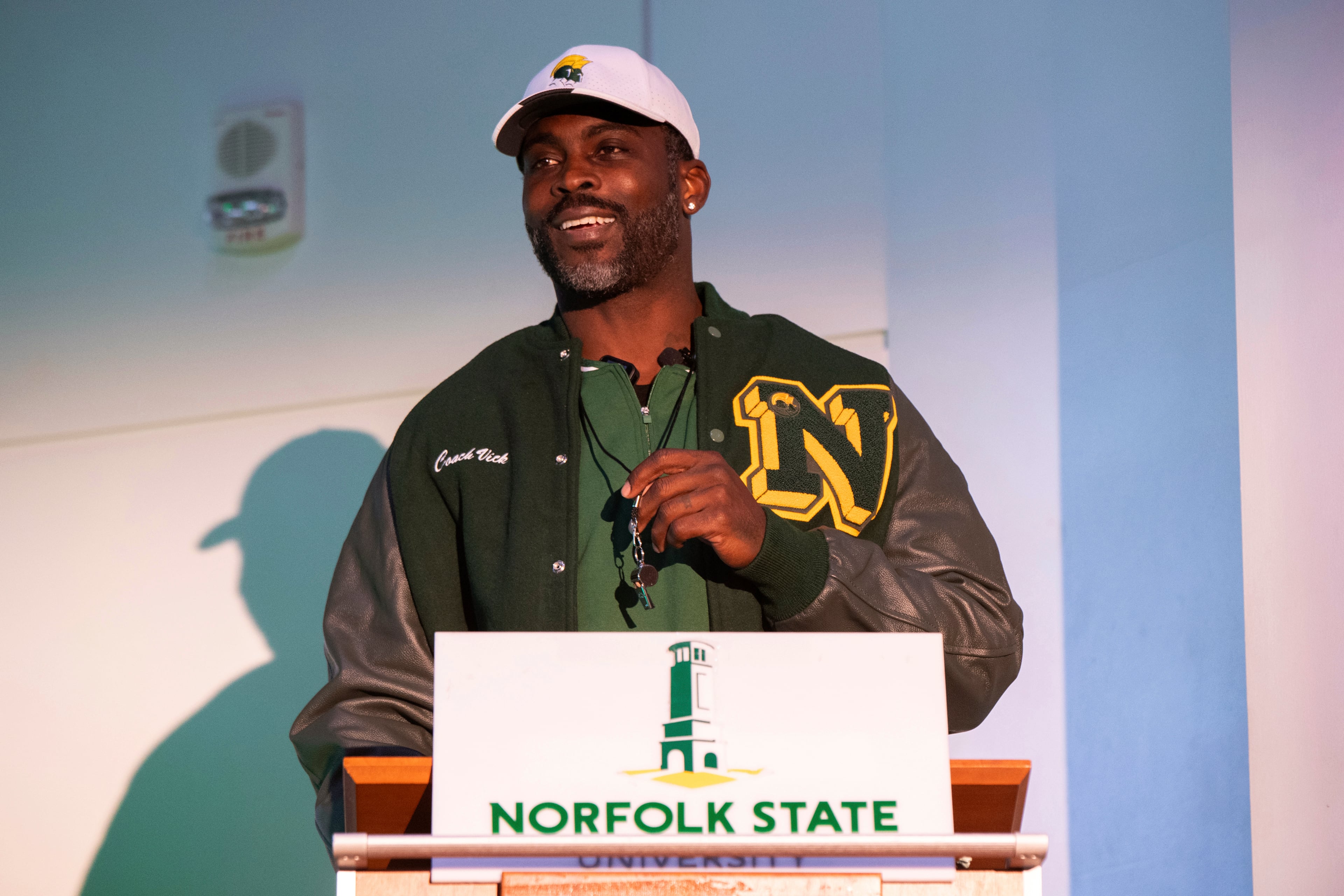 Michael Vick holds a whistle around his neck after he is introduced as the head coach of the Norfolk State football team during a press conference on Monday, Dec. 23, 2024. Vick earned his first Division I win when his team beat Hampton over the weekend. (Mike Caudill/AP)