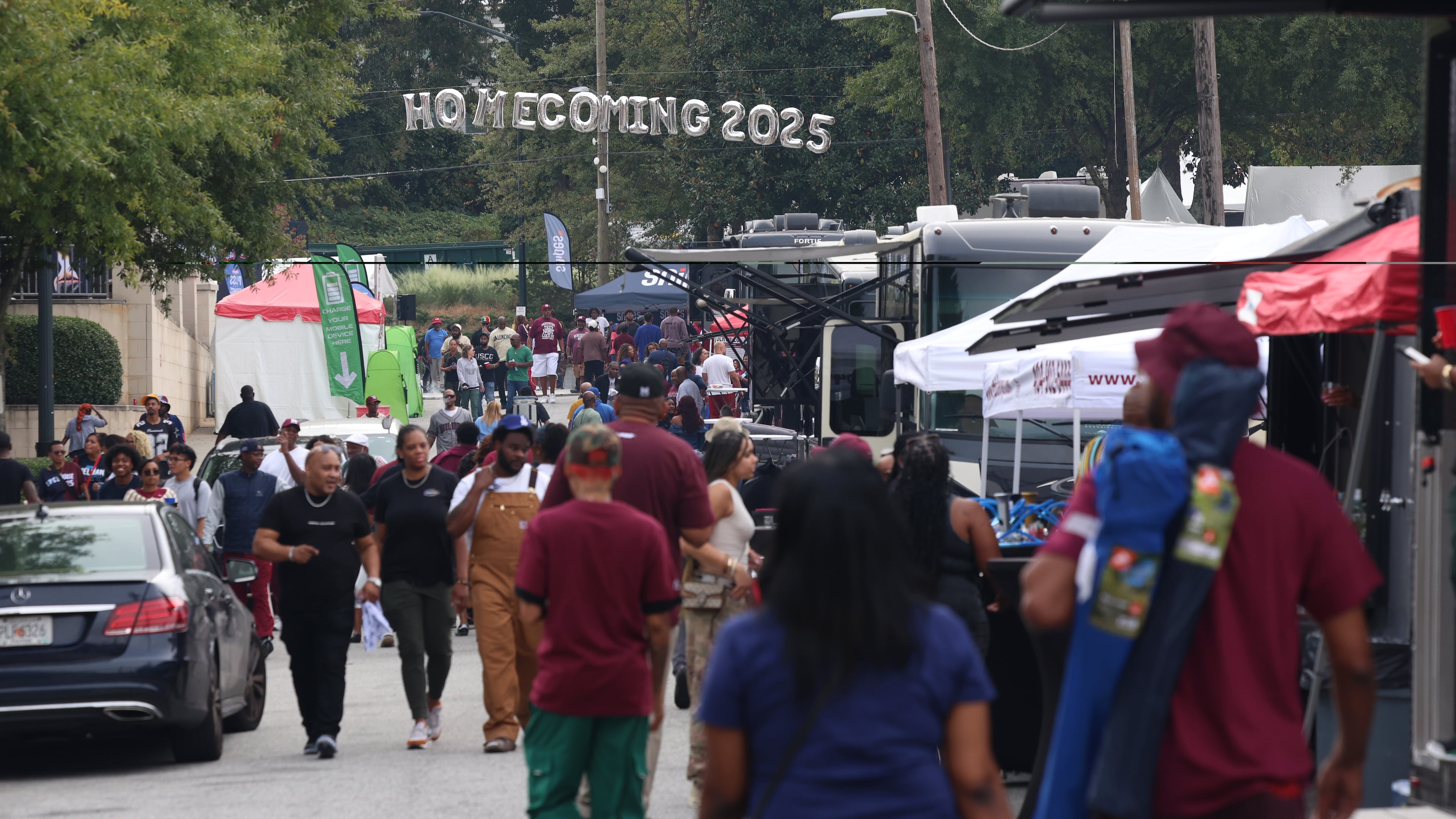 People attend the Morehouse Homecoming Tailgate Experience, one of the many events celebrating Spelhouse Homecoming, a joint commemoration between Morehouse and Spelman colleges.(Akili-Casundria Ramsess, EyeAkili Media for the AJC)