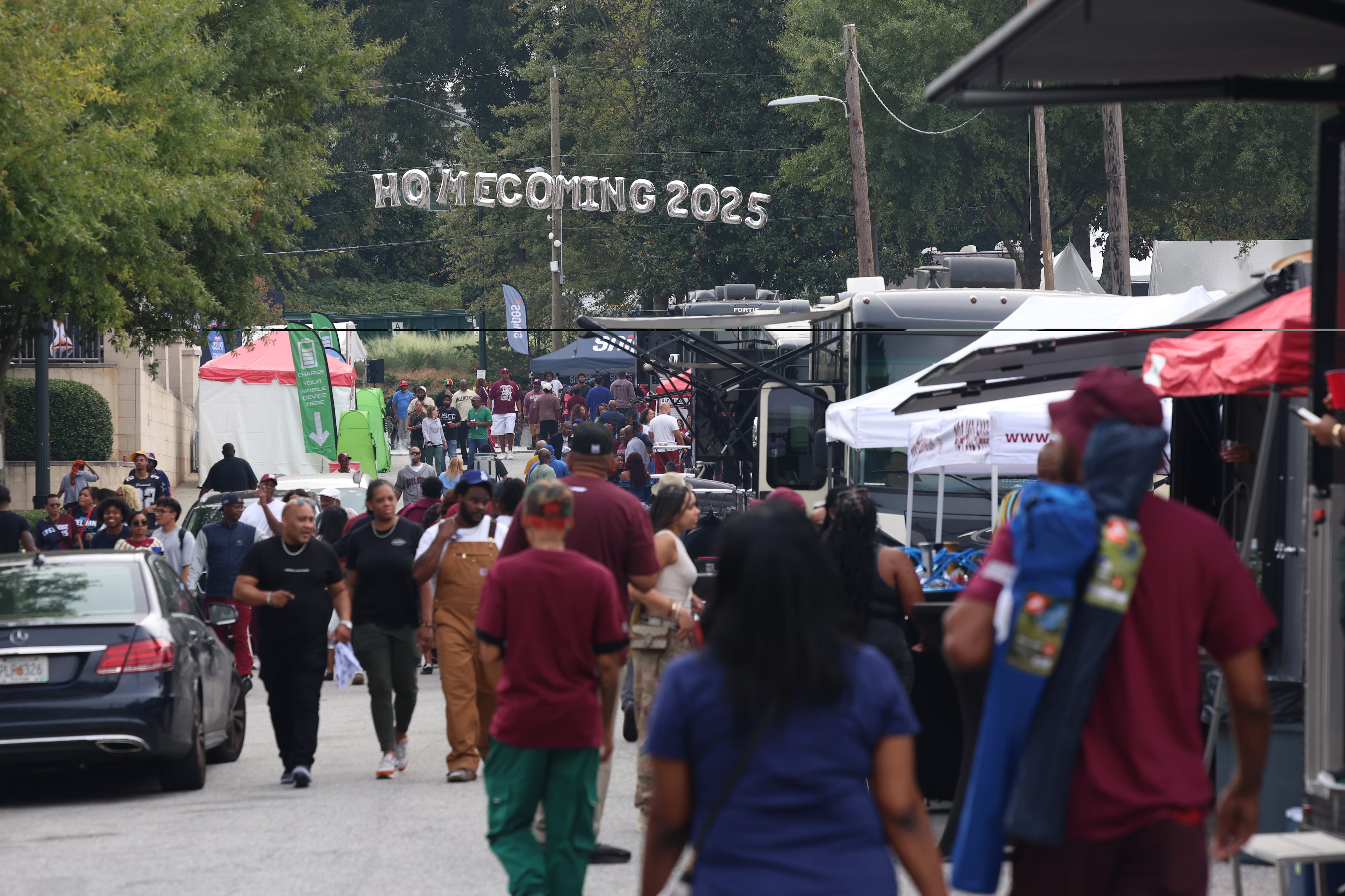 People attend the Morehouse Homecoming Tailgate Experience, one of the many events celebrating Spelhouse Homecoming, a joint commemoration between Morehouse and Spelman colleges.(Akili-Casundria Ramsess, EyeAkili Media for the AJC)