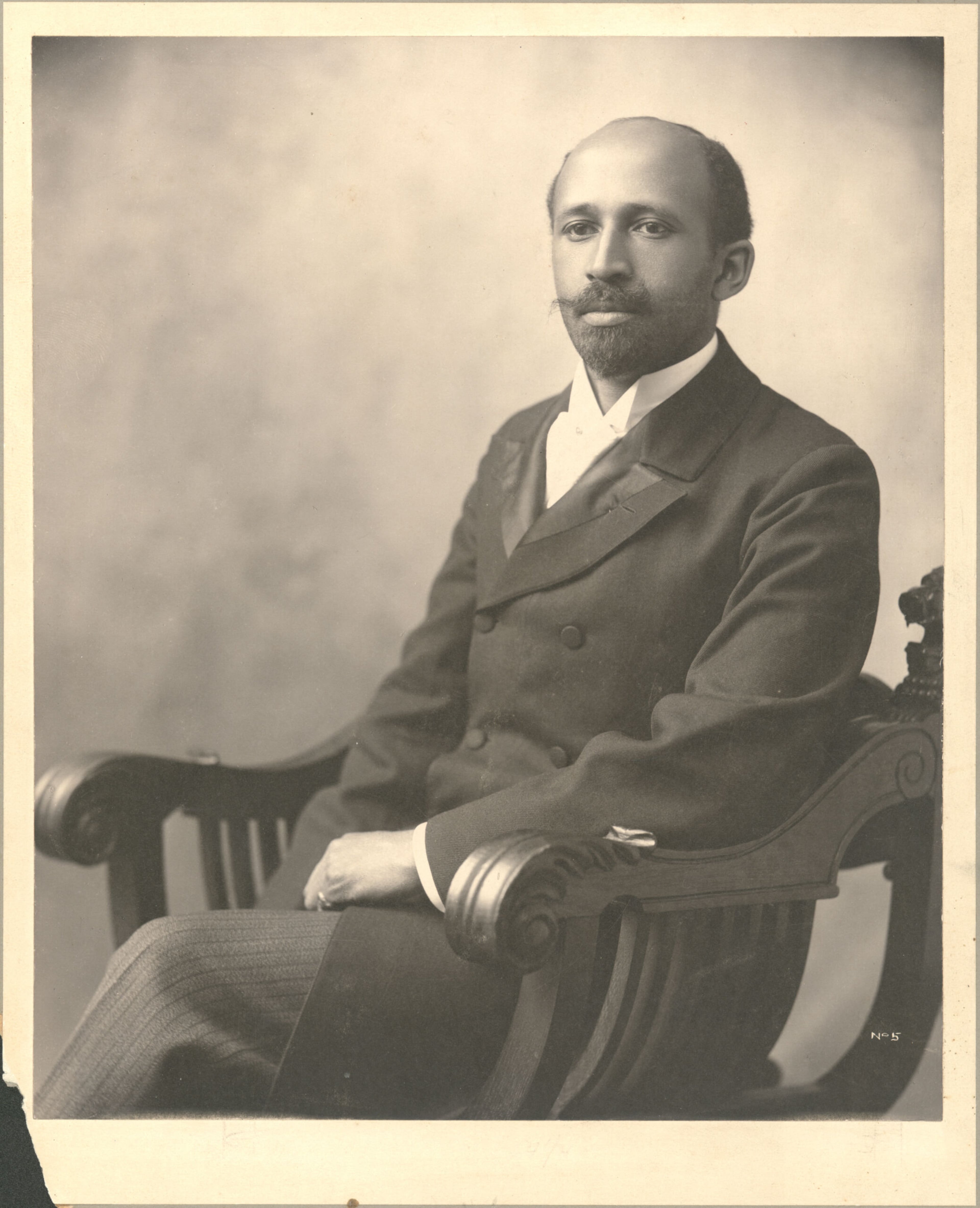 Portrait of Du Bois in armchair. (Special Collections and University Archives, University of Massachusetts Amherst Libraries)