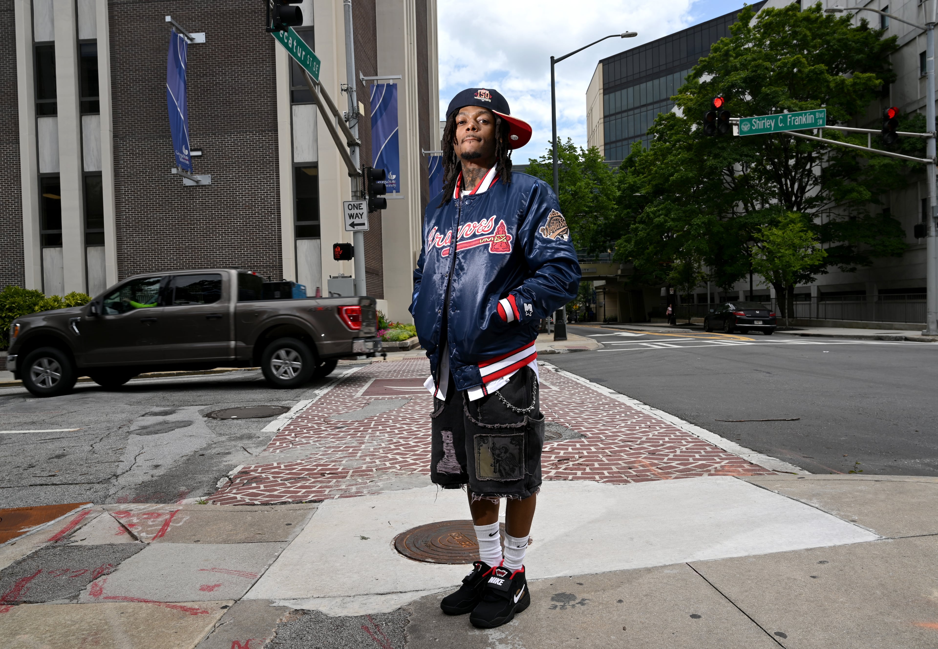 Atlanta-born rapper JID poses for a photo at Walter's Clothing Store in downtown Atlanta, Tuesday, July 1, 2025. (Hyosub Shin/AJC)