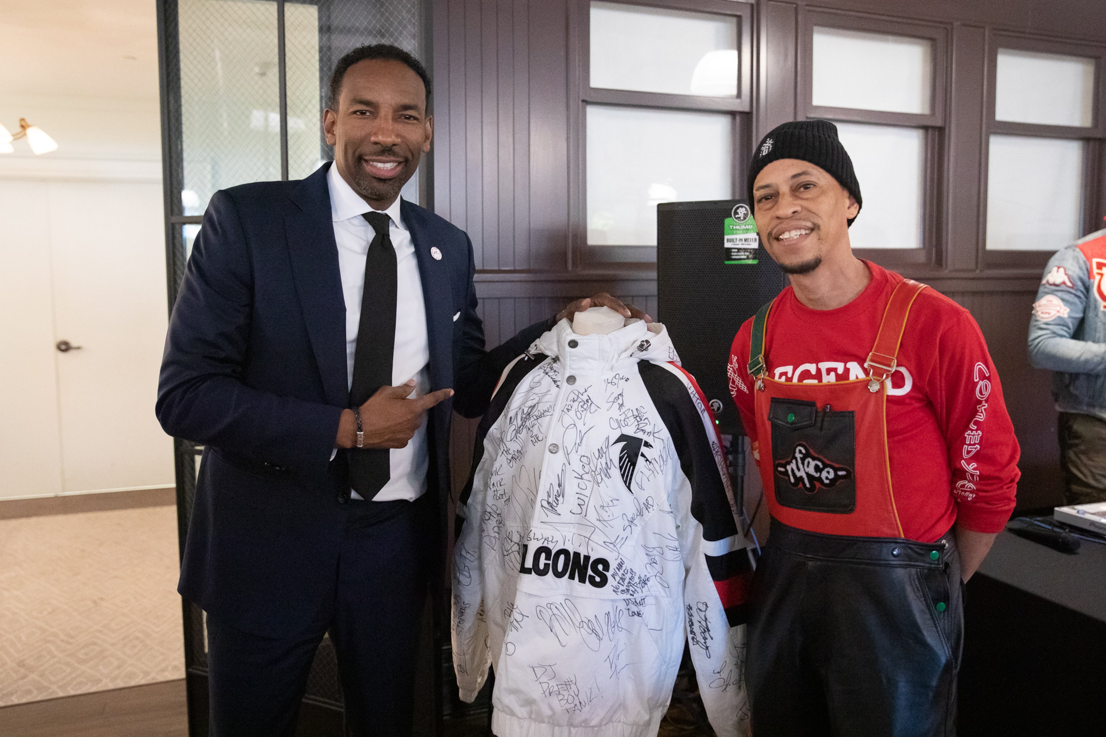 Atlanta Mayor Andre Dickens (left) and Larry "Nuface" Compton pose for a photo at a city of Atlanta event celebrating 50 years of hip hop in 2023. Nuface has attended both of Dickens' inaugurations. (Riley Bunch/AJC 2023)