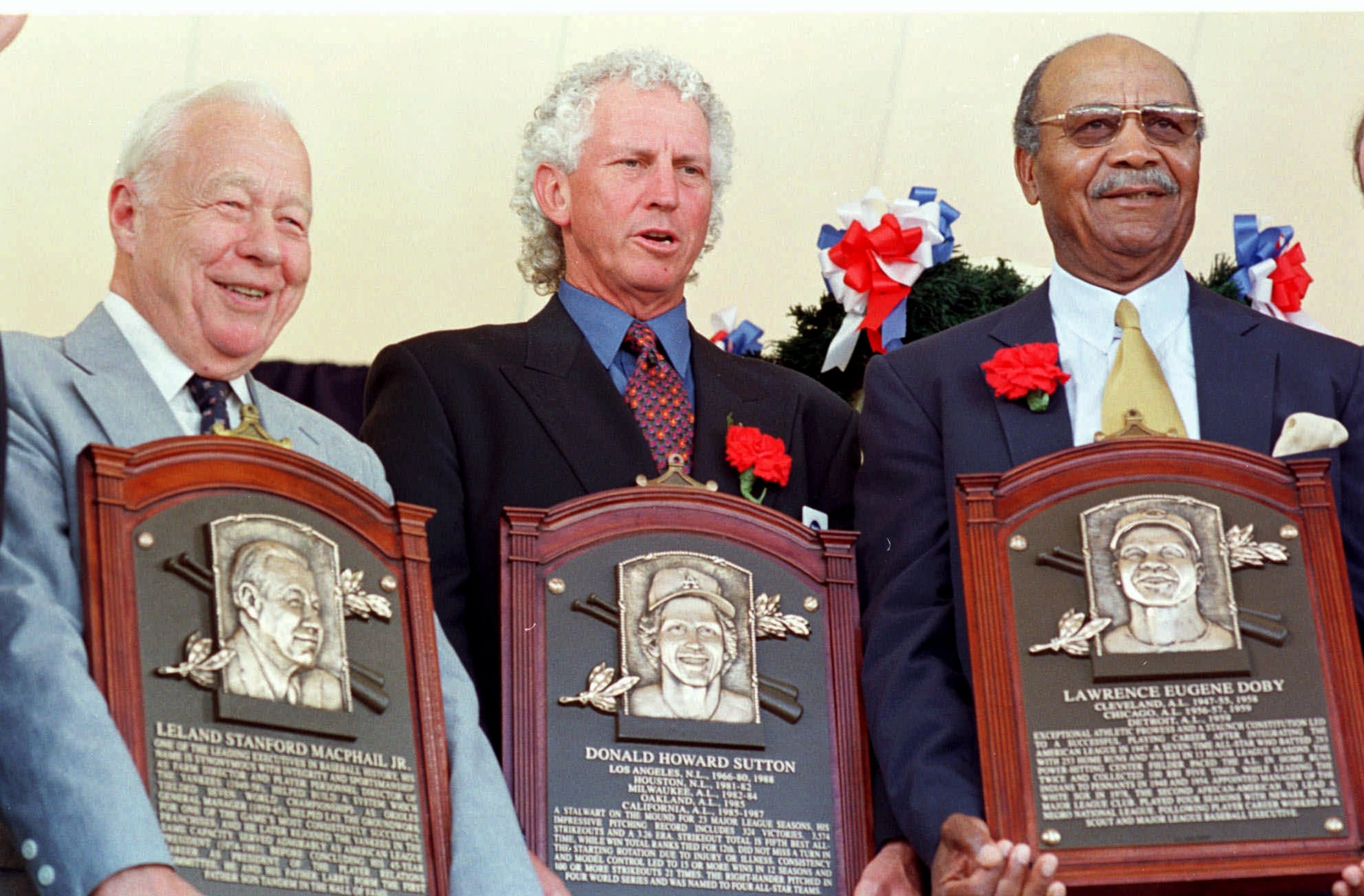 Larry Doby (right), who played at historically Black Virginia Union University, was the second Black player in the major leagues and entered the Baseball Hall of Fame in 1998. (David Jennings/AP 1998)