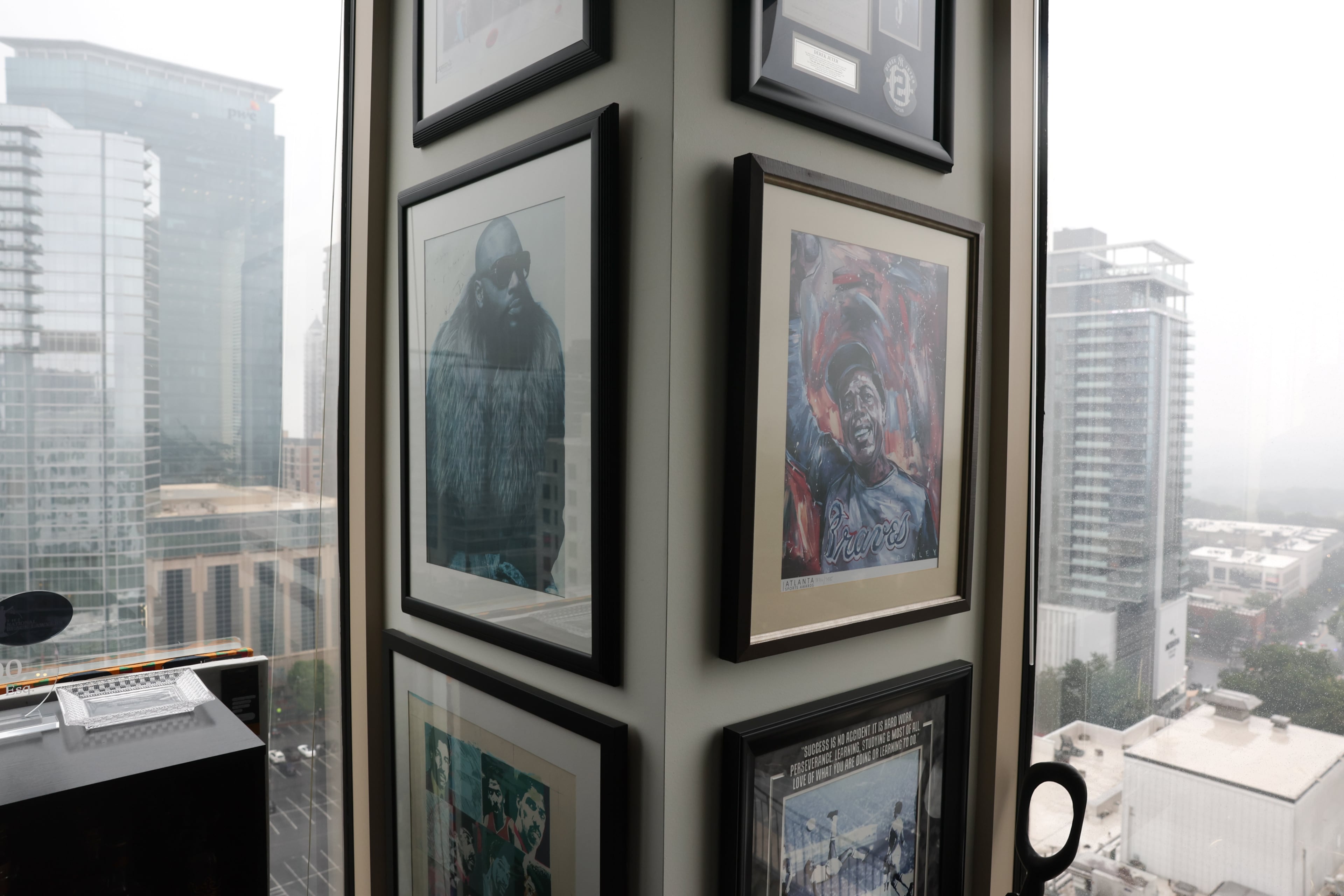Memorabilia decorates a guest room by Atlanta-based entertainment attorney John Rose’s office at Fox Rothschild in Atlanta on June 16, 2026. Rose, 33, just became the youngest partner at Fox Rothschild. (Arvin Temkar/AJC)
