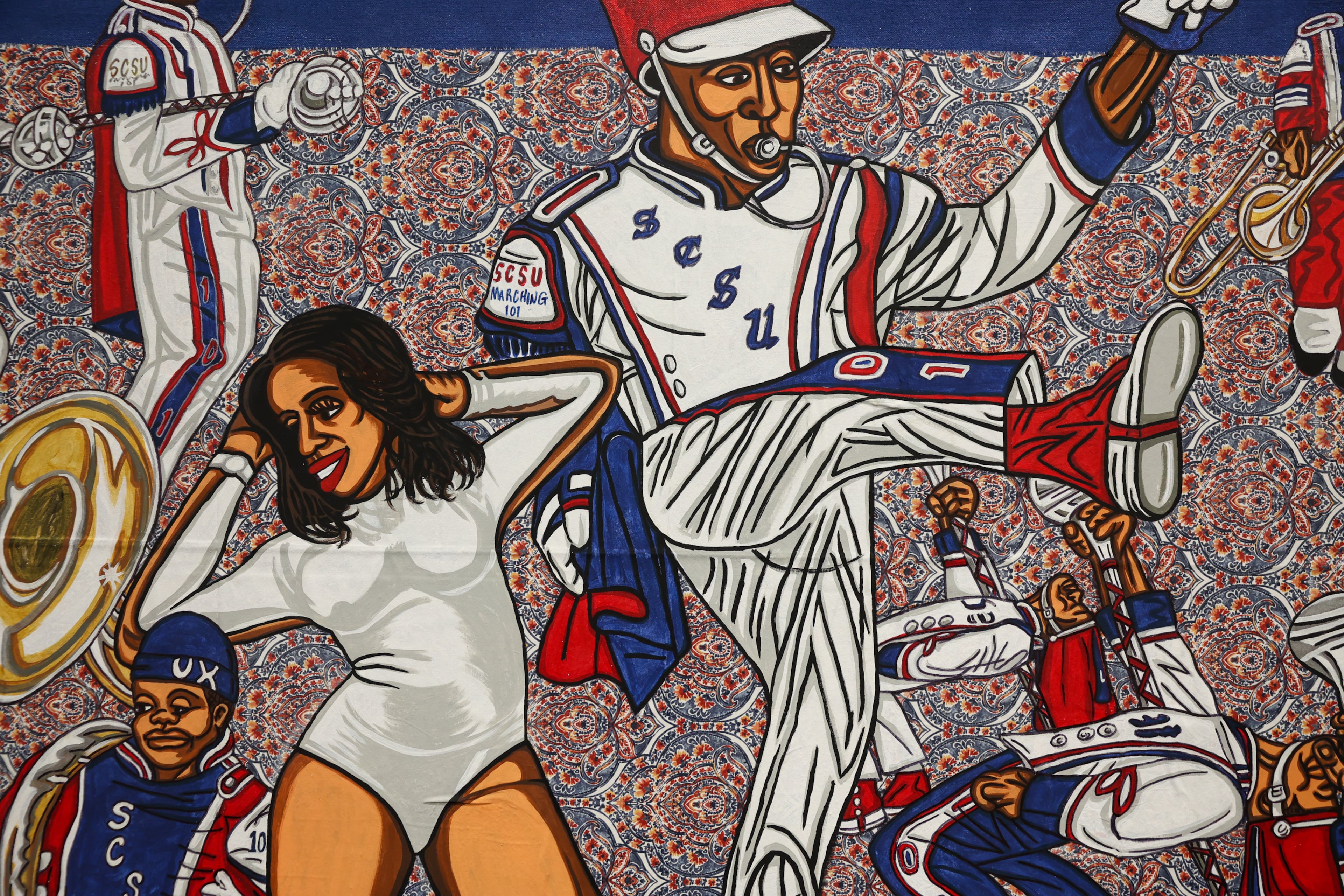 A closeup view of a piece in artist Keith Duncan’s exhibit “Battle of the Bands,” inspired by HBCU band culture, at the College Football Hall of Fame in Atlanta on Sept. 11, 2026. Duncan utilizes bright colors to convey the competition and pageantry between the bands. (Arvin Temkar/AJC)