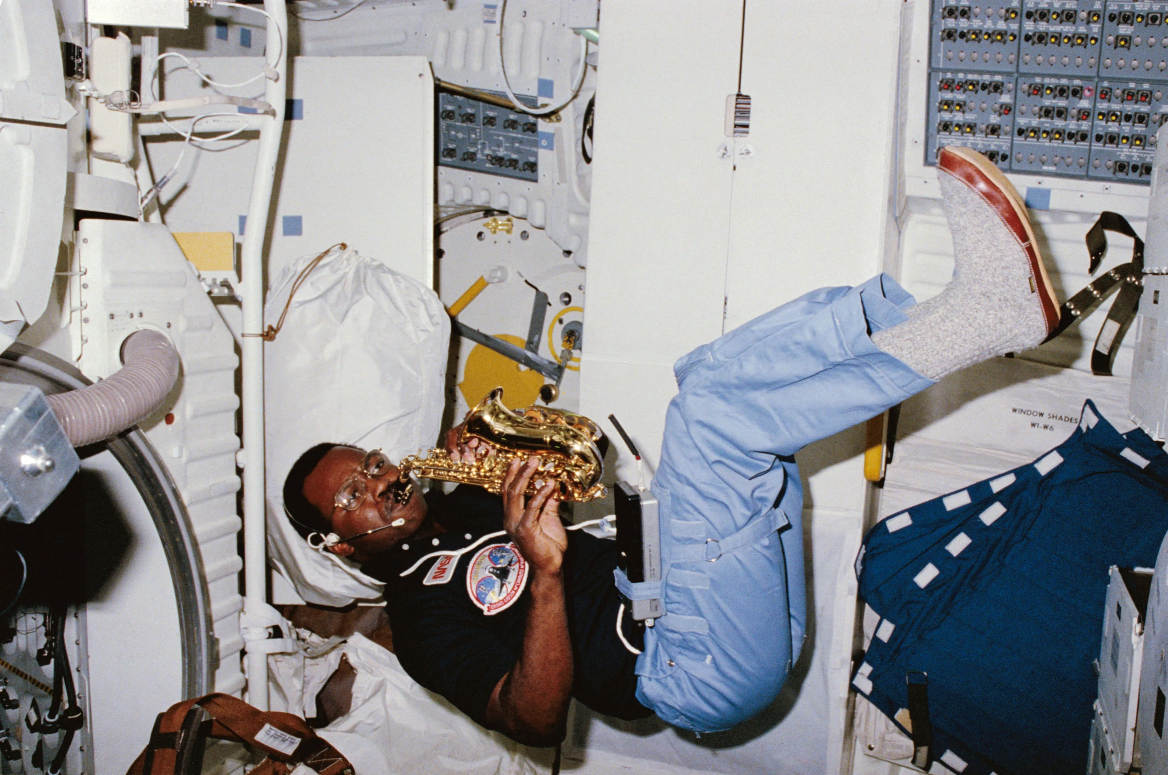 In this photo taken Feb. 8, 1984, NASA astronaut Ronald McNair plays his saxophone while off duty during the STS-41B mission. (NASA)