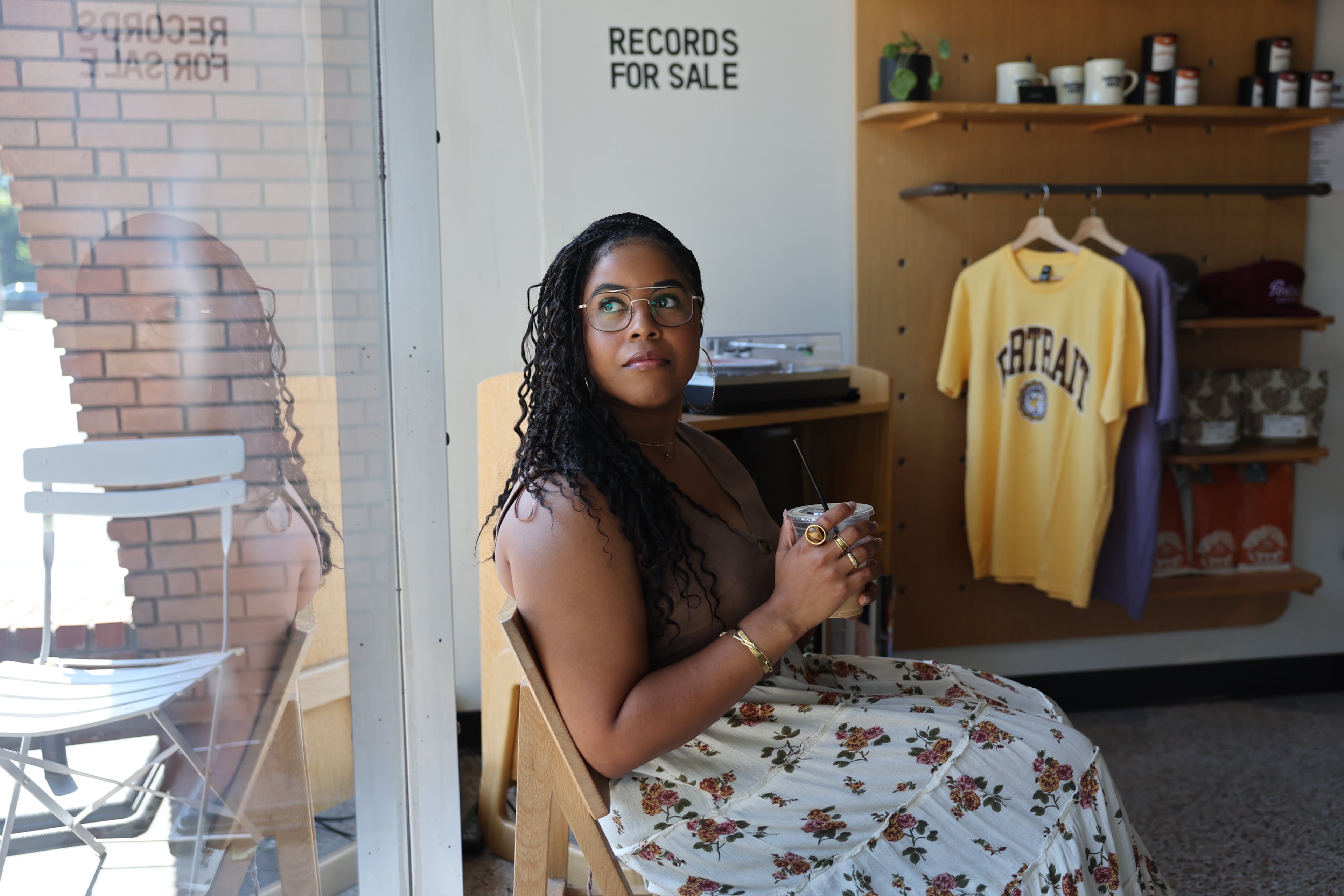 AJC multimedia journalist Najja Parker enjoys a caffeine boost from Portrait Coffee in Atlanta. Parker can trace her coffee shop obsession back to her graduate school days in Chicago. (Arvin Temkar/AJC)