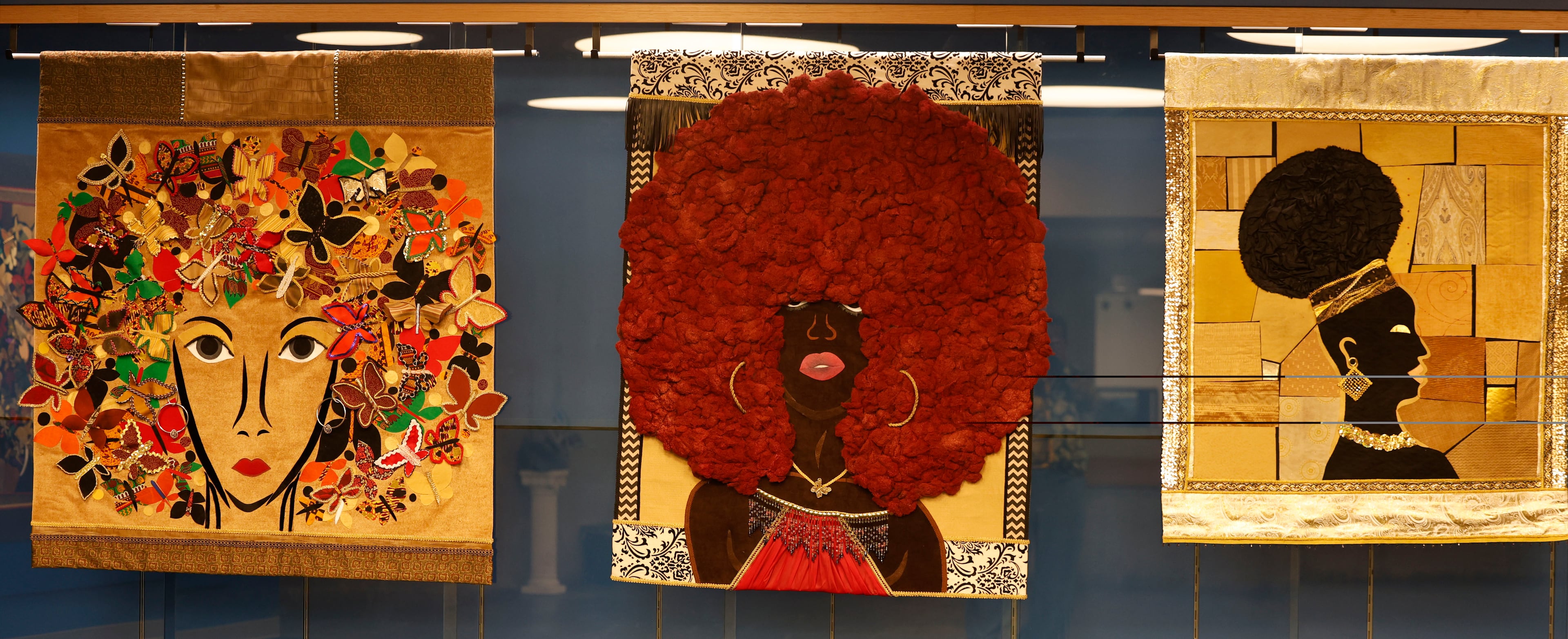 Art pieces consisting of fabric collage with textiles and acrylics are a part of the opening reception of artist J. Stacey Grayson art exhibition at the Fulton County Central Library. Saturday, November 8, 2025. (Akili-Casundria Ramsess, EyeAkili Media for the AJC)