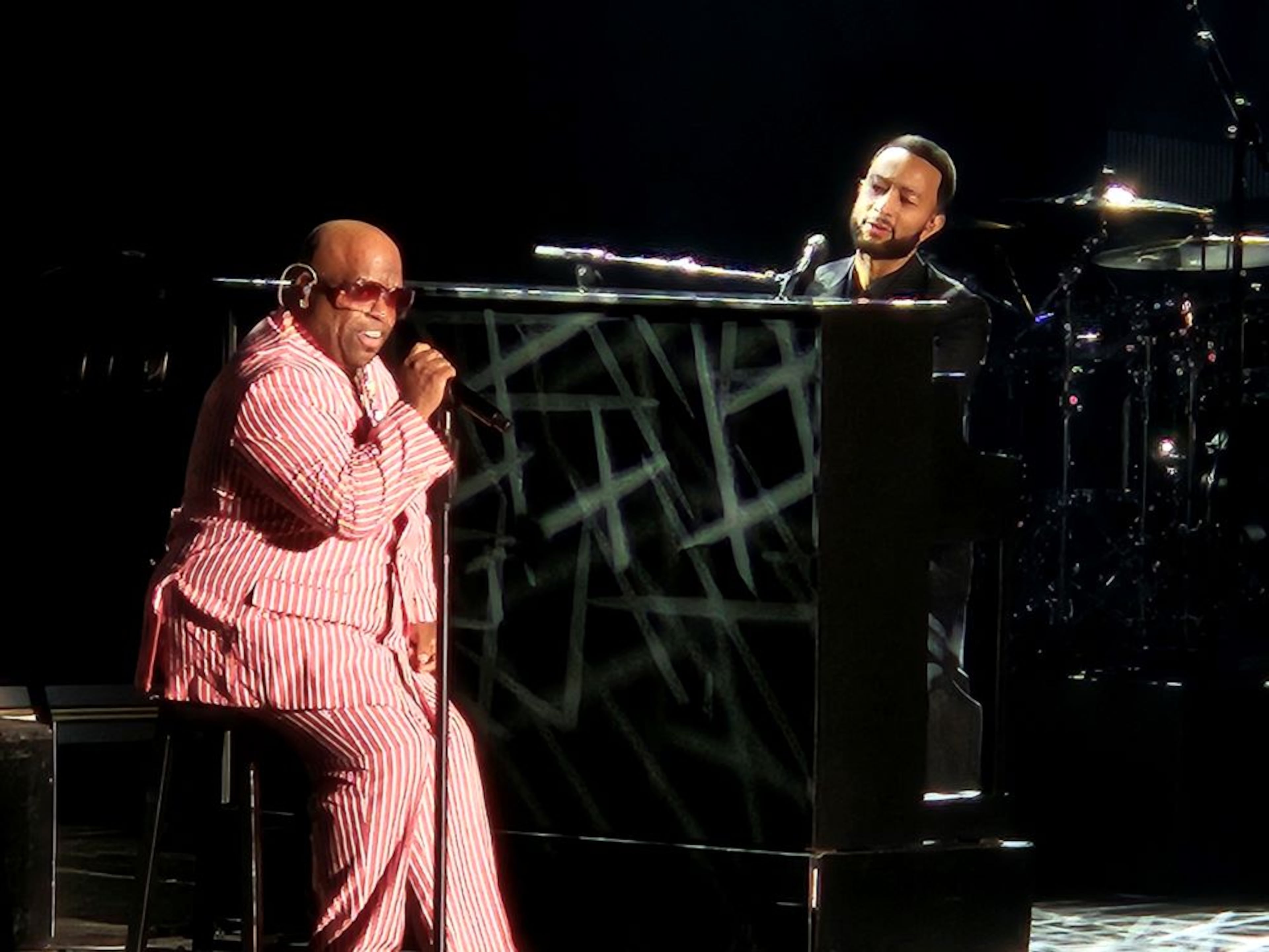 Grammy-winning artist CeeLo Green (left) performs “Ordinary People” with John Legend at Synovus Bank Amphitheater at Chastain Park on Friday, Oct. 24, 2025, in Atlanta. Legend invited three Atlanta hip-hop artists to join him throughout the evening. (Christopher Daniel/AJC)