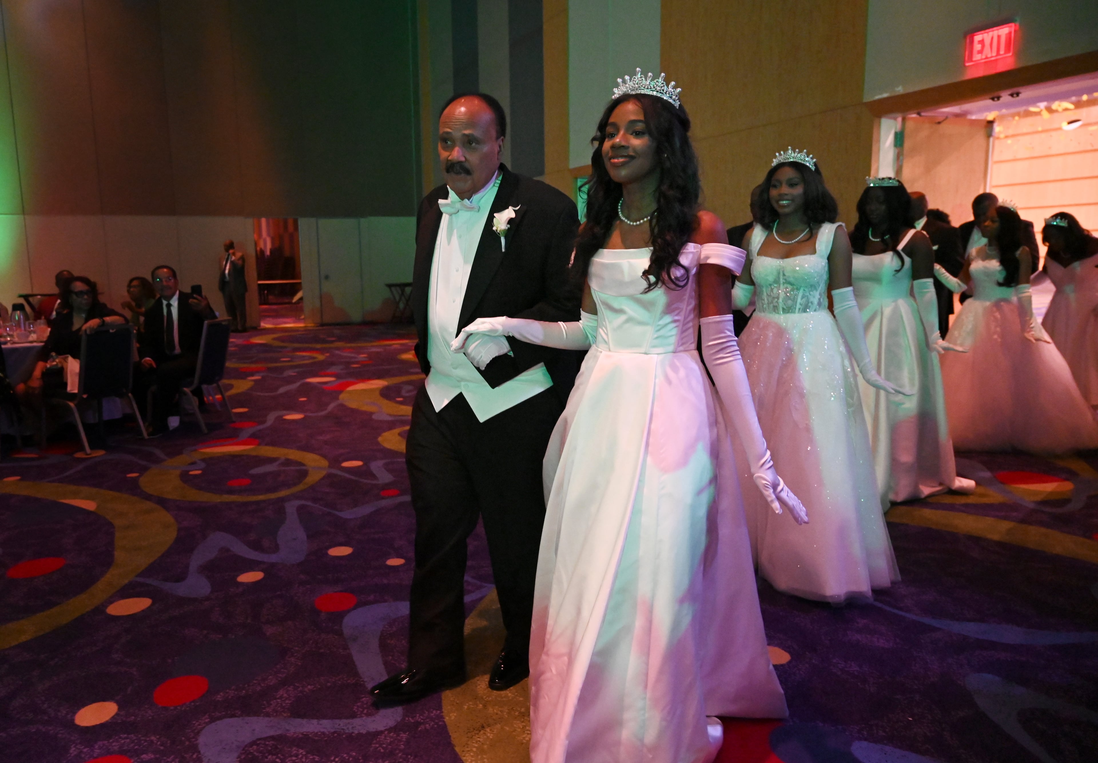 Debutante Yolanda Renee King is escorted by her father Martin Luther King III during 2026 Pink Cultured Pearls Cotillion sponsored by the Ivy Community Foundation at Georgia International Convention Center, Sunday, March 29, 2026, in Atlanta. (Hyosub Shin/AJC)