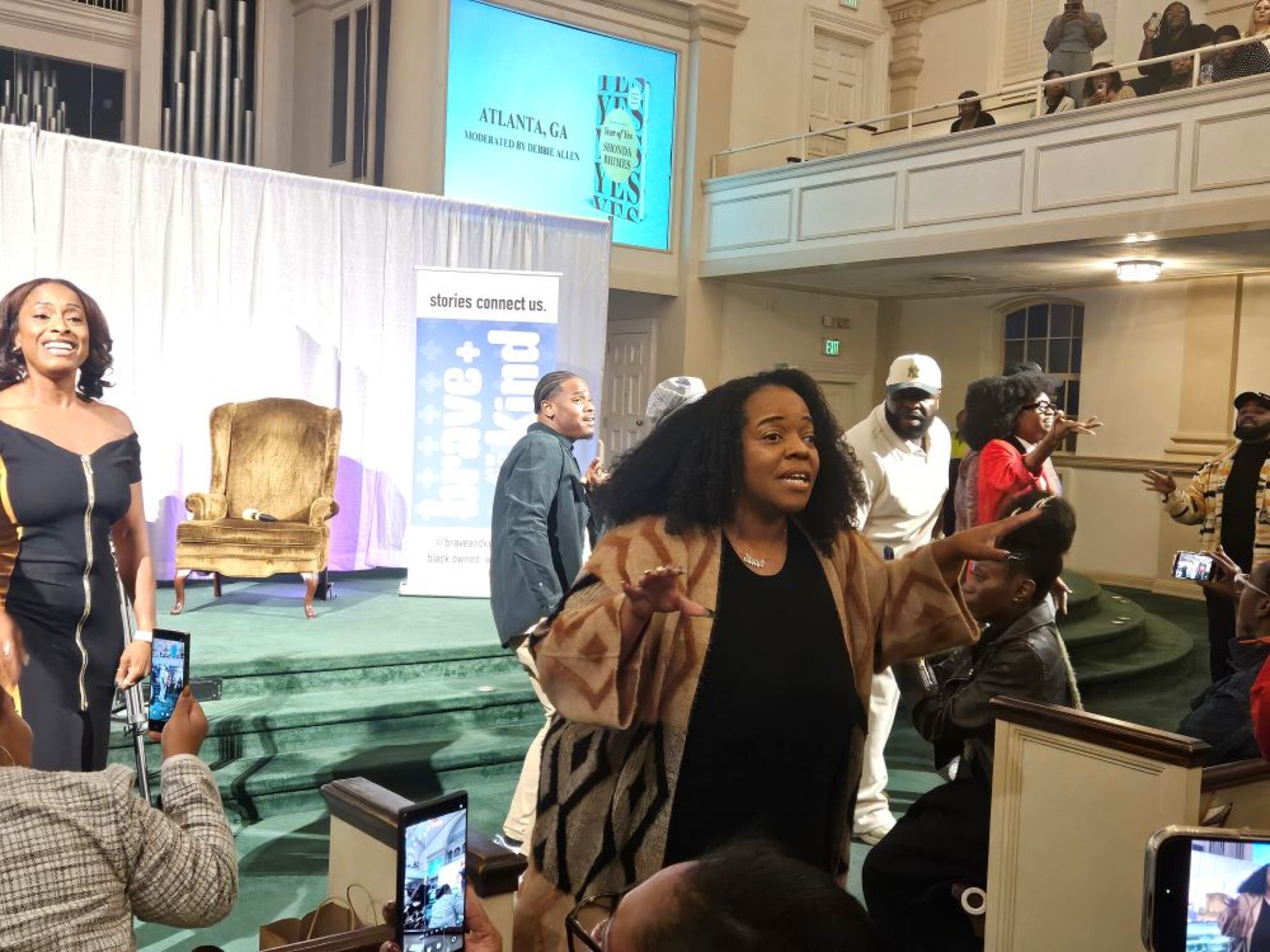 Member of CommUNITY ATL Choir perform singer Bill Withers' 1977 hit 'Lovely Day' during series creator Shonda Rhimes' book tour for 'Year of Yes' at First Baptist Church of Decatur on Thursday, Oct. 23, 2025. (Christopher A. Daniel/AJC)