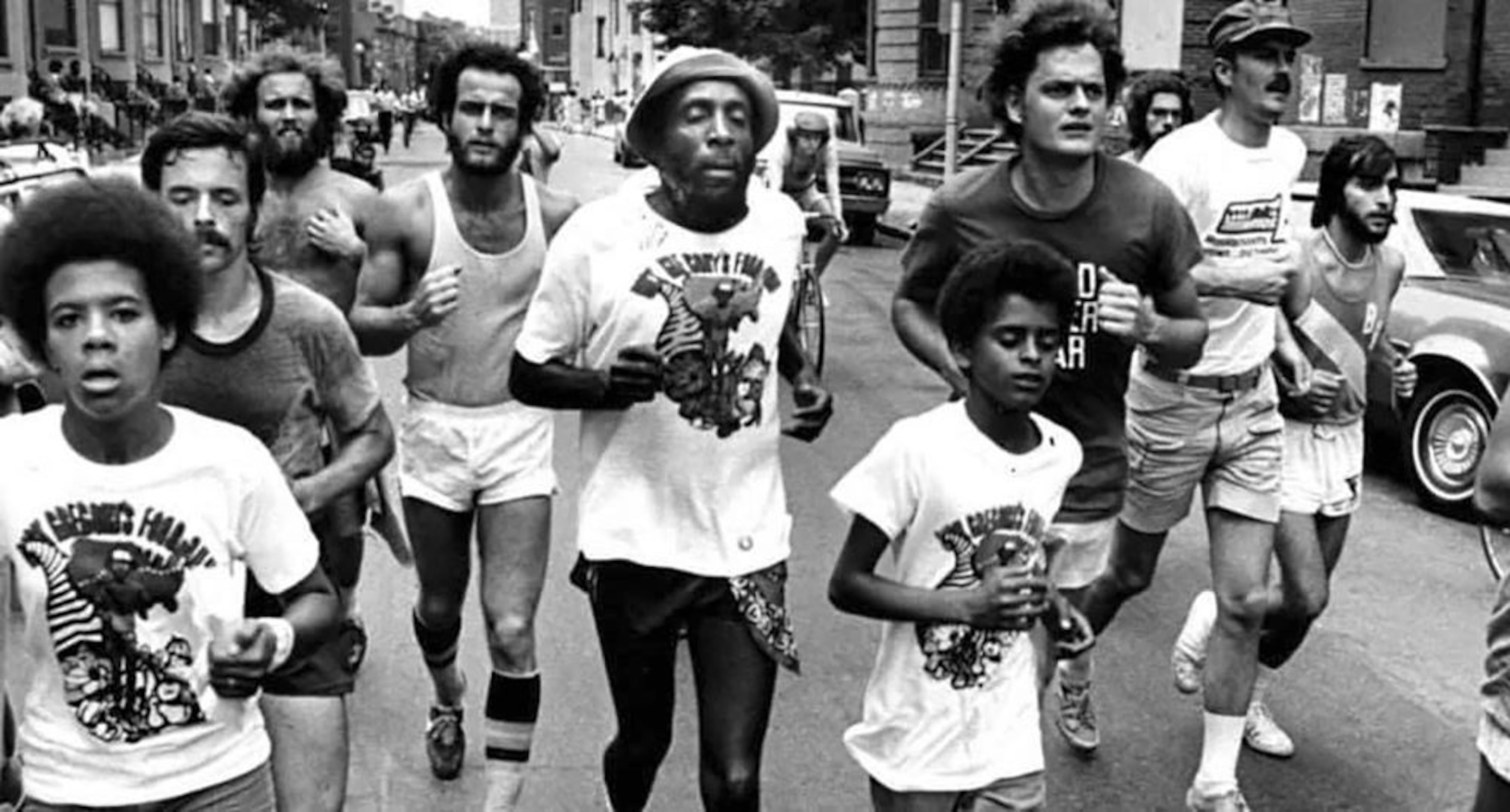 Comedian and activist Dick Gregory (center), shown running for hunger and poverty in 1976, published many books in his lifetime. His son, Christian, says the new children’s book helps continue his dad’s legacy. (Courtesy of Dick Gregory Media)