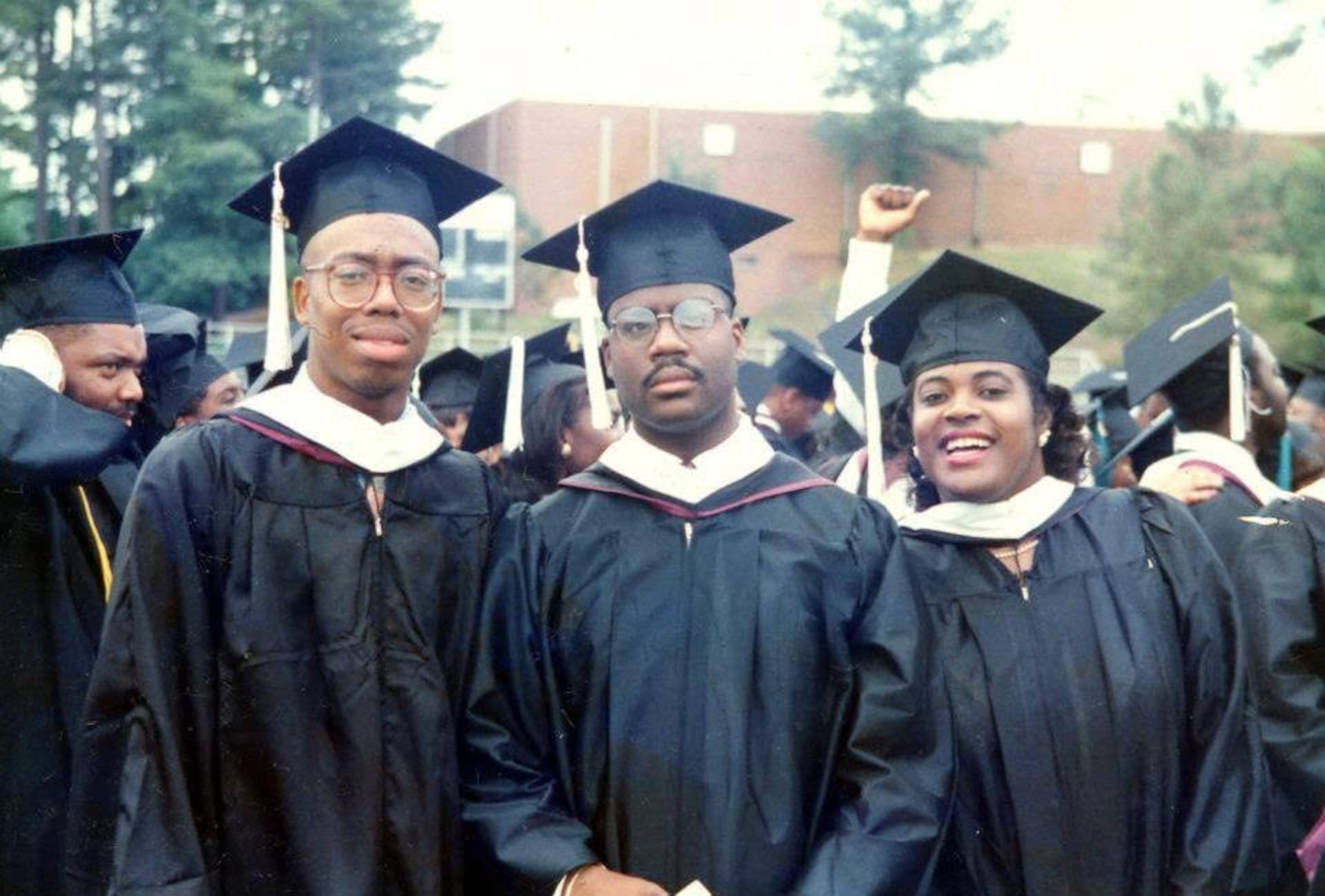 UATL Senior Editor Ernie Suggs, Donald Mason and Madelyn Hooker, all English majors at North Carolina Central University, at their 1990 college graduation. (Courtesy of Ernie Suggs)