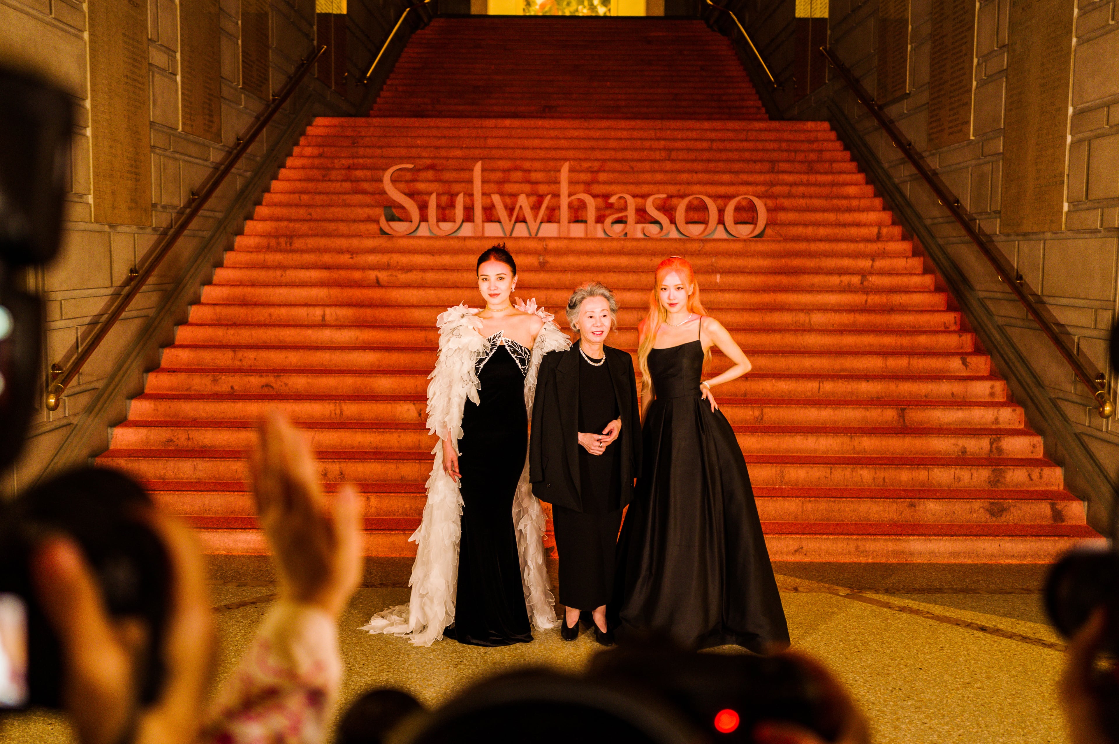 The actresses Jia Song, left, and Yuh-Jung Youn, center, and the pop star Ros celebrate the Korean beauty brand Sulwhasoo at the Metropolitan Museum of Art in New York on March 29, 2023. (Ye Fan/The New York Times)