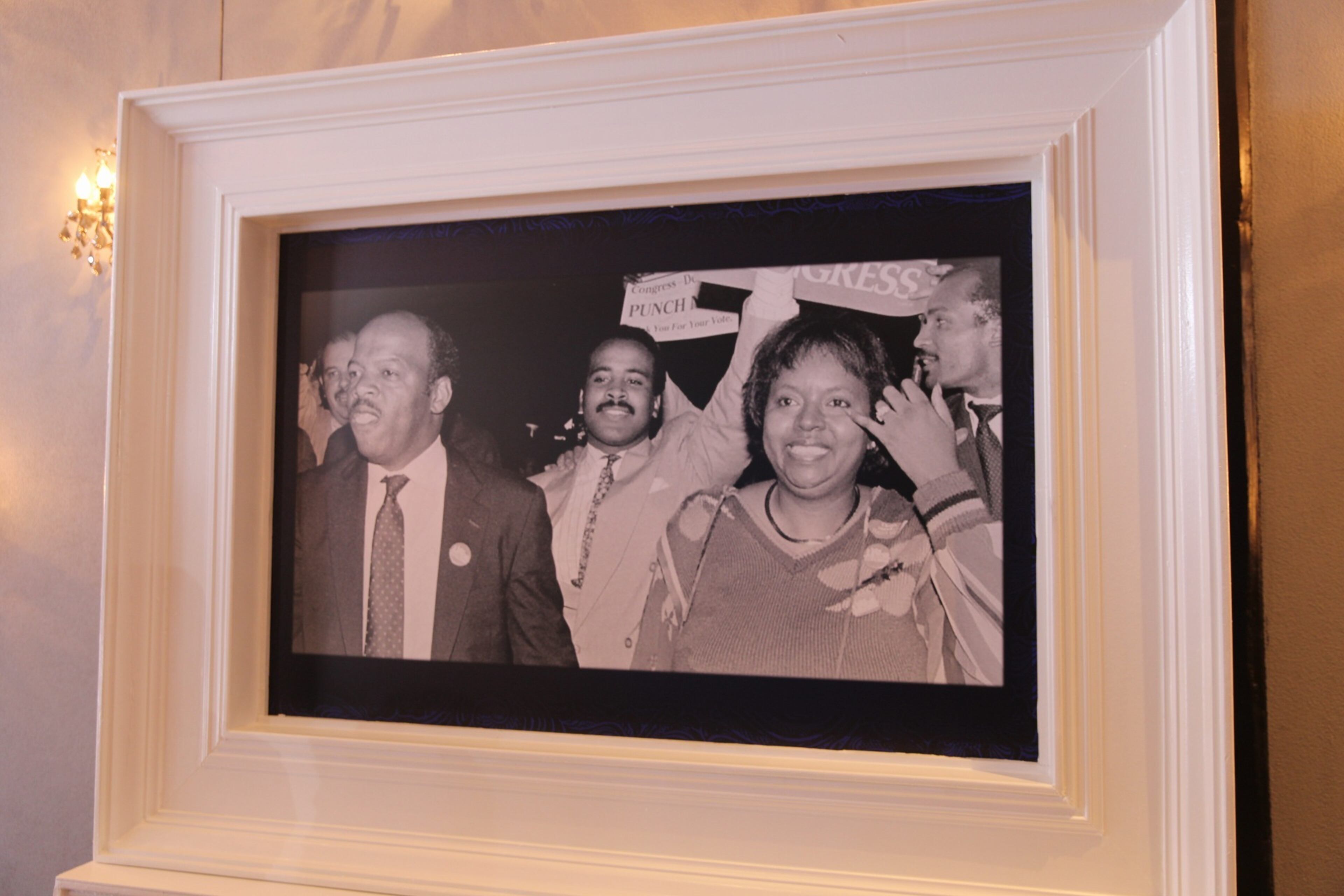 A portrait of civil rights icon and former U.S. Congressman John Lewis and his wife, Lillian, adorn a wall at Flourish during the annual Good Trouble Gala, which honors their work. (Zaire Breedlove/AJC)