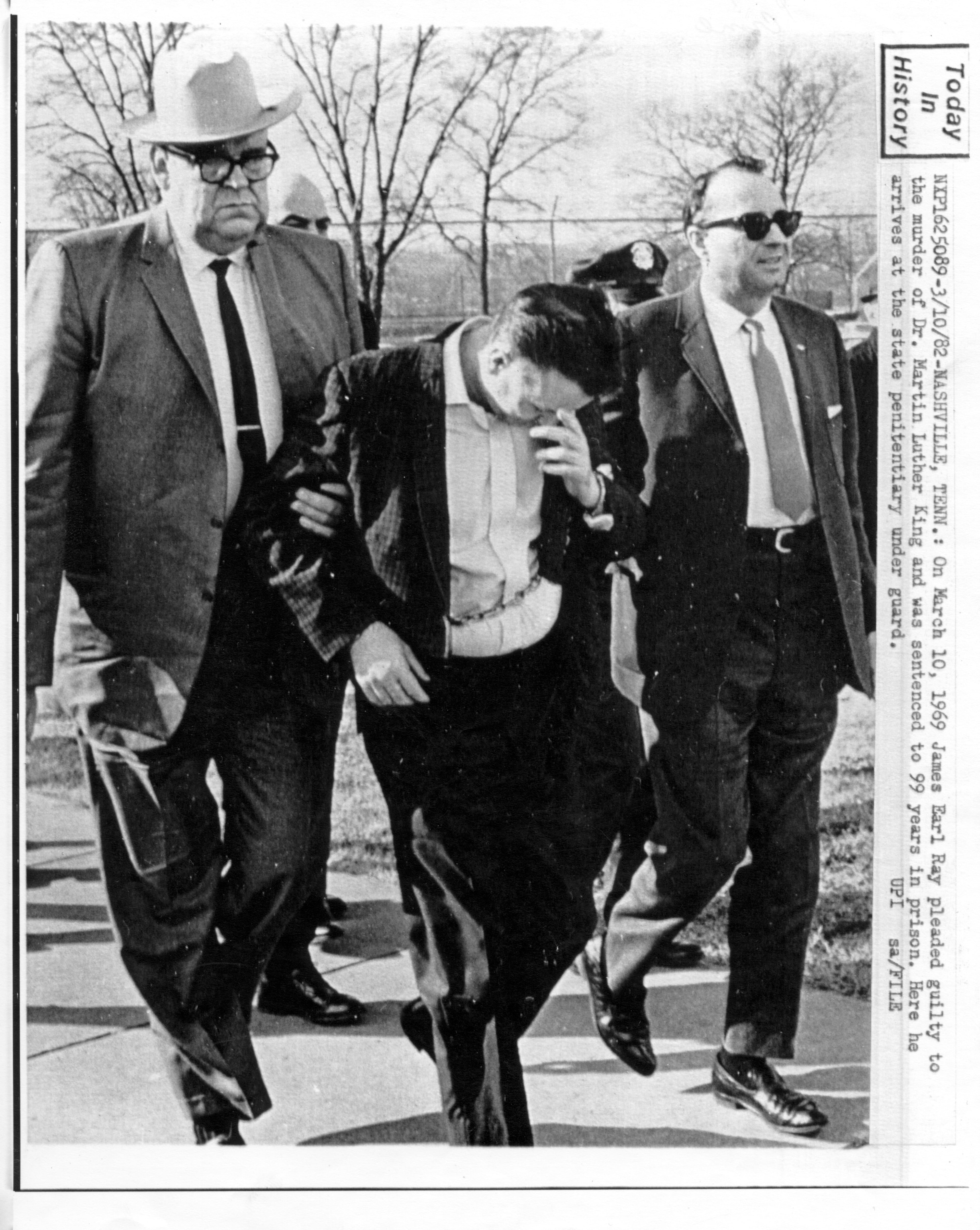 On March 10th, 1969, James Earl Ray pleaded guilty to the murder of the Rev. Martin Luther King Jr. and was sentenced to 99 years in prison. Here he arrives at the State Penitentiary under guard. (File)