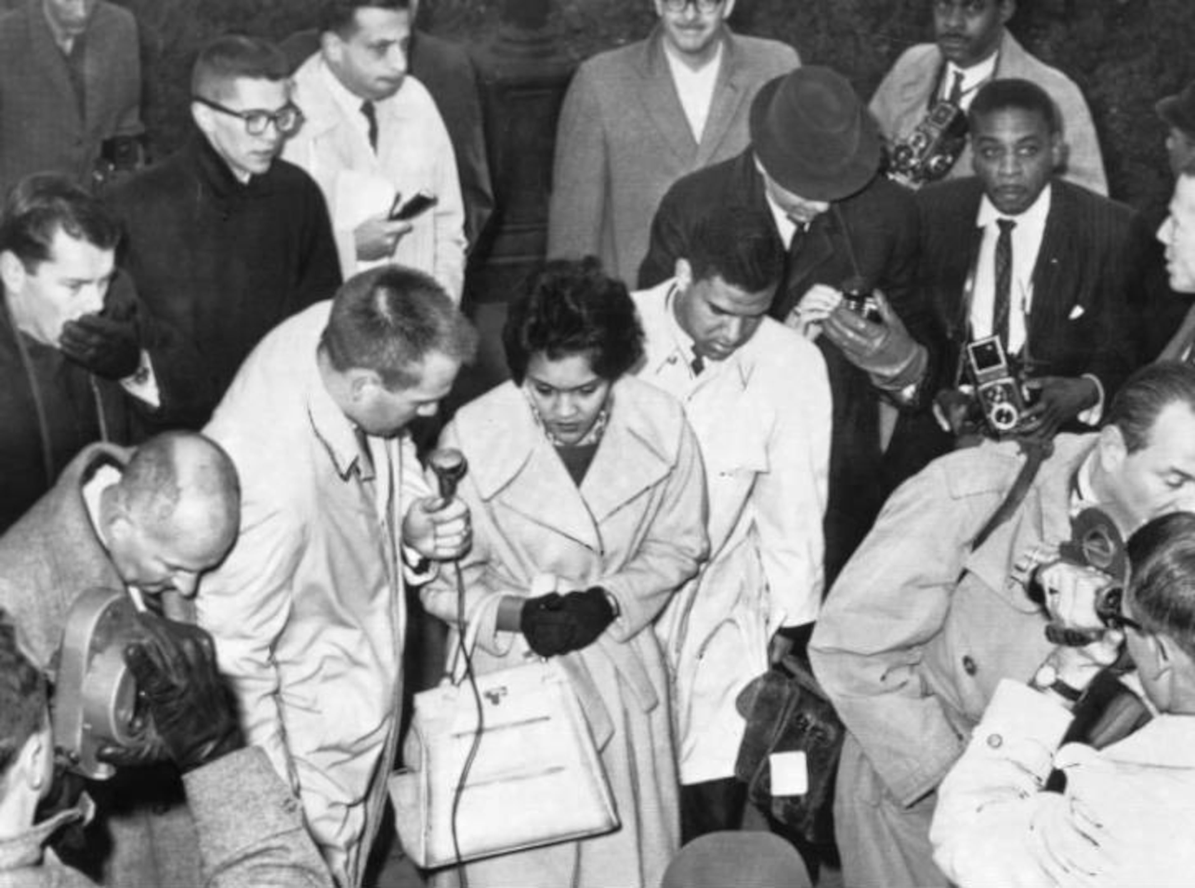 Charlayne Hunter and Hamilton Holmes arrive at the University of Georgia before the judge stays order, on Jan. 9, 1961. They were selecting courses when registration was suspended. (Charles R. Pugh Jr./AJC file photo)