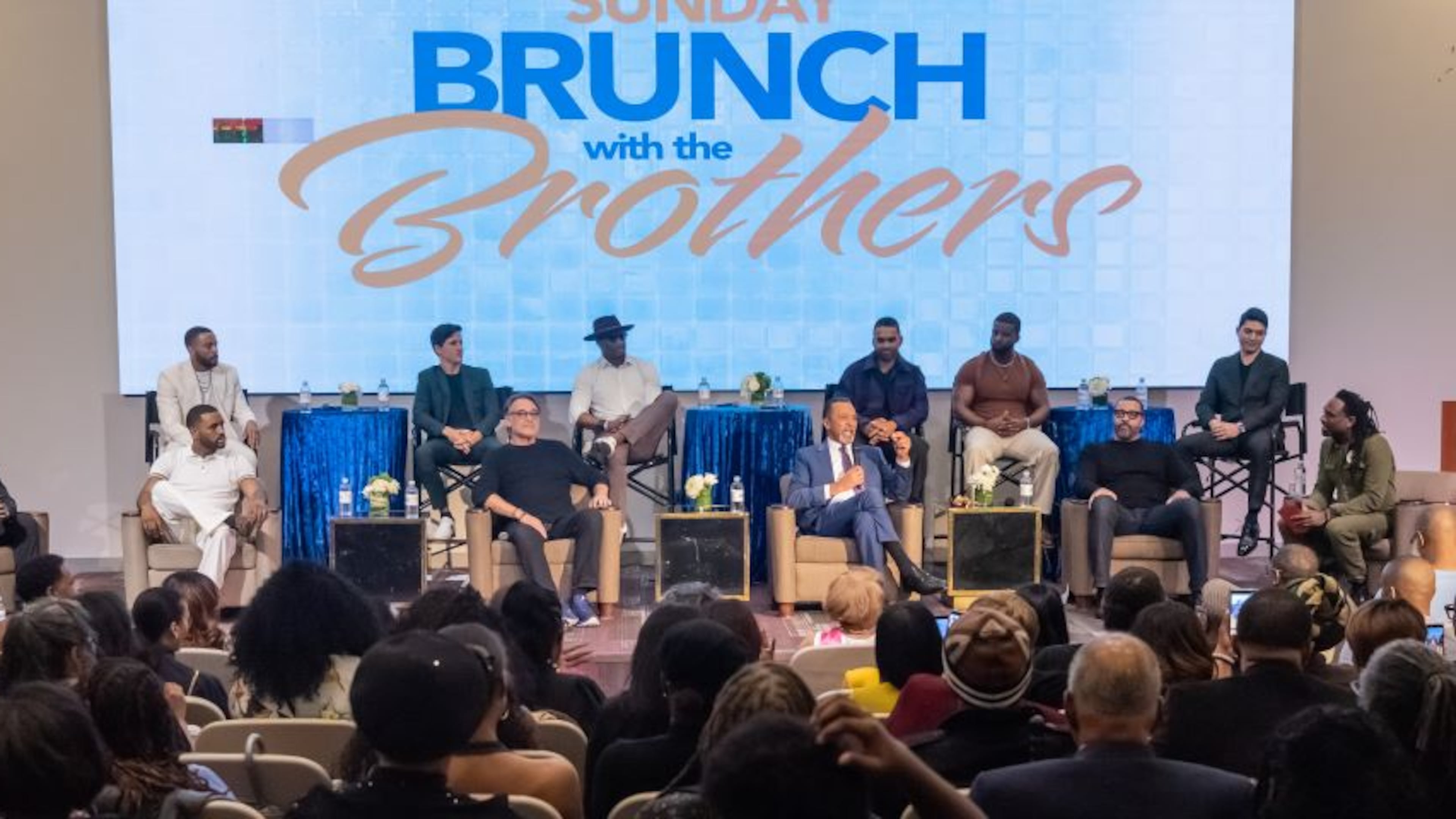 Actors (front, from left) Keith Robinson, Sean Freeman, Jon Lindstrom, Clifton Davis and Timon Kyle Durrett, and (back, from left) Jibre Hordges, Mike Manning, Robert Christopher Riley, Lami, Maurice Johnson and Alex Alegria take the stage Sunday at BronzeLens Film Festival's Brunch with the Brothers to talk about their roles on "Beyond the Gates," the CBS soap opera with a primarily Black cast. (Courtesy of Daniel G. Morris)