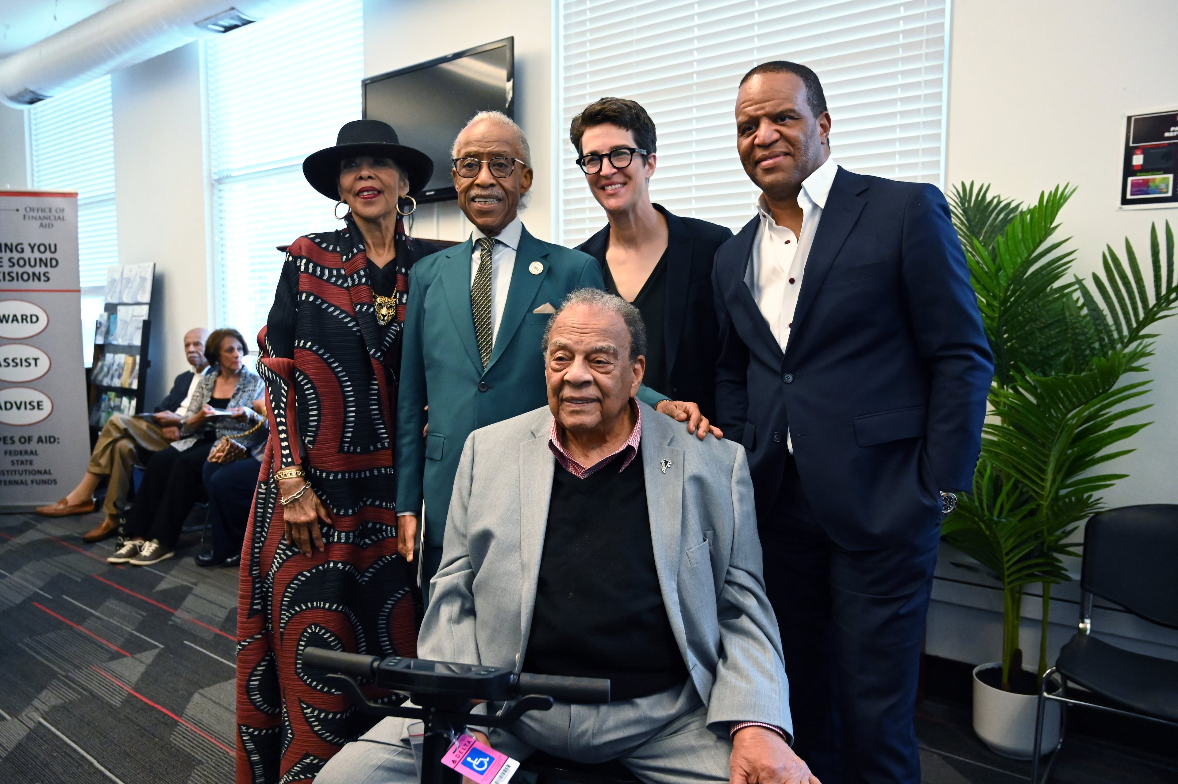 Ambassador Andrew Young (seated) poses for photos with his wife, Carolyn Young (from left); the Rev. Al Sharpton; Rachel Maddow, MSNBC executive producer; and John Hope Bryant, CEO of Operation HOPE, before a special panel conversation ahead of the world premiere of the MSNBC documentary “Andrew Young: The Dirty Work,” at Clark Atlanta University on Oct. 14, 2025. (Hyosub Shin/AJC)