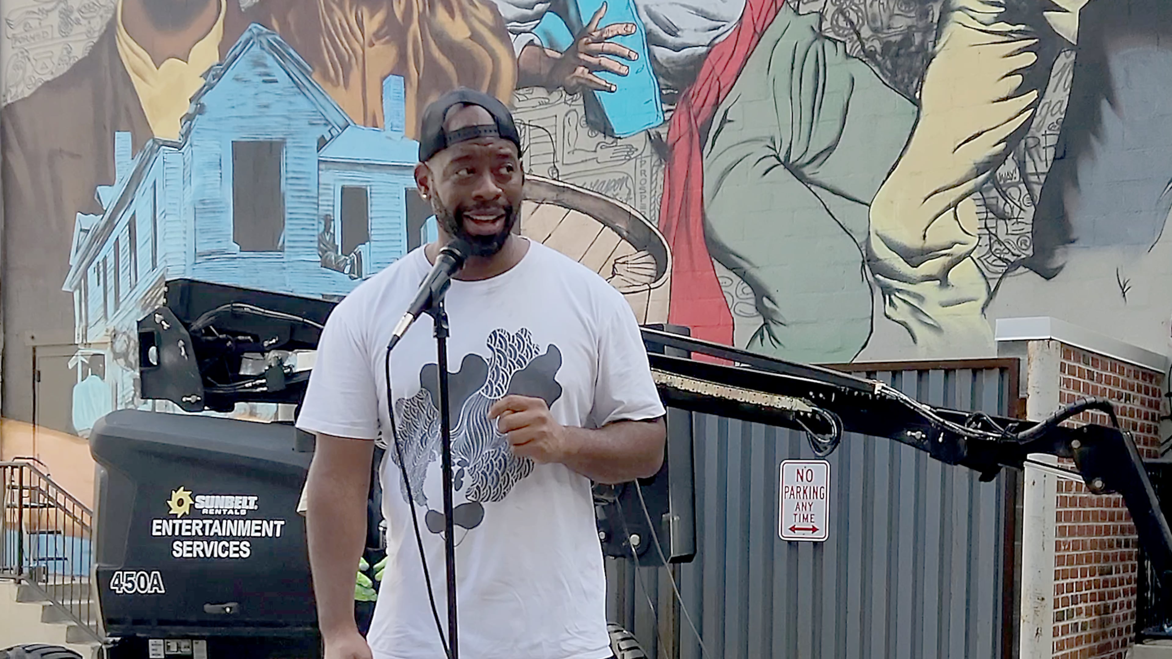 Artist Fabian Williams painted the 1906 Atlanta Race Massacre mural. (Courtesy of the National Center of Civil and Human Rights)