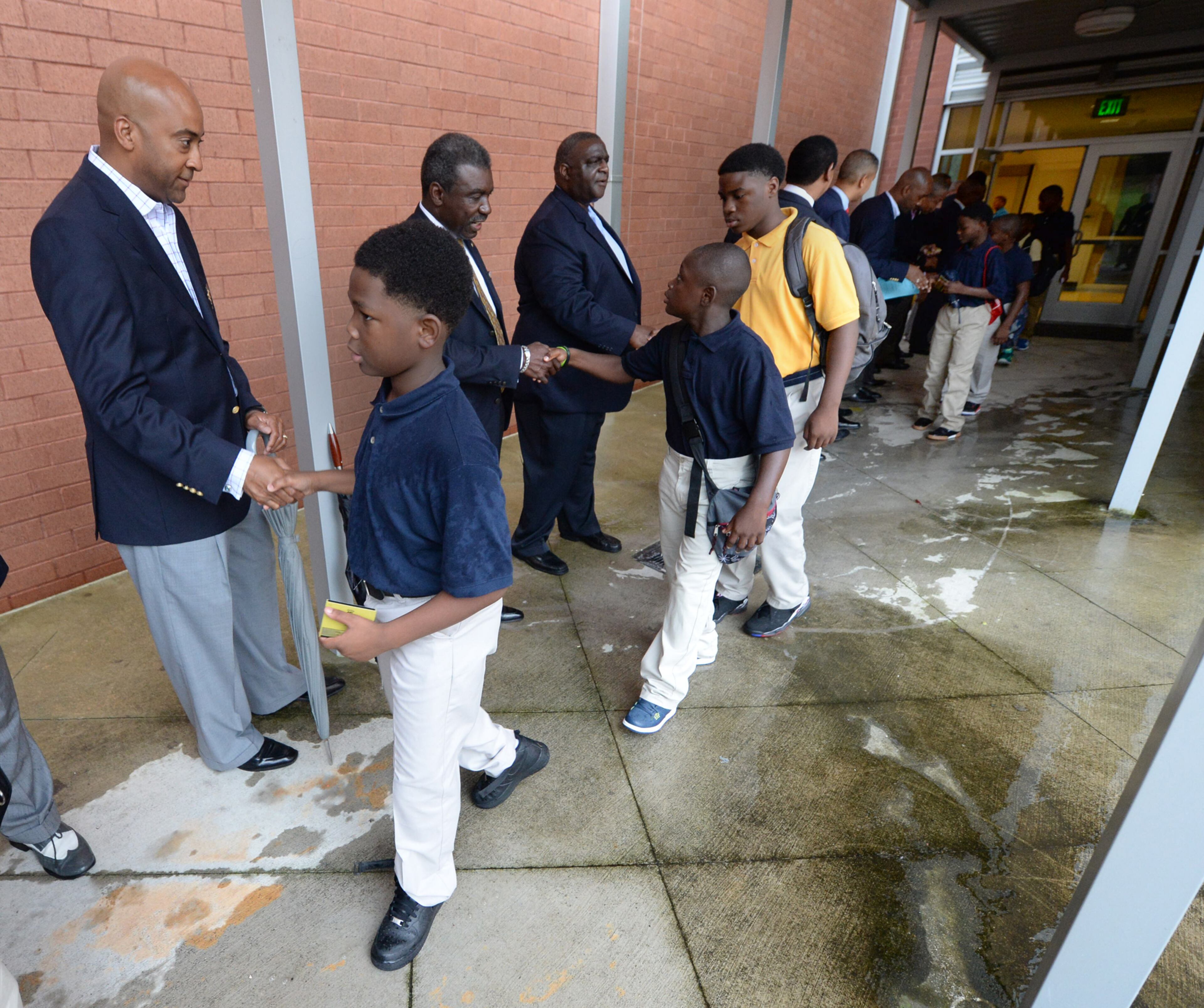 More than 80 members of the 100 Black Men of Atlanta greeted the boys and their parents as they arrived on the first day of school at at B.E.S.T Academy.