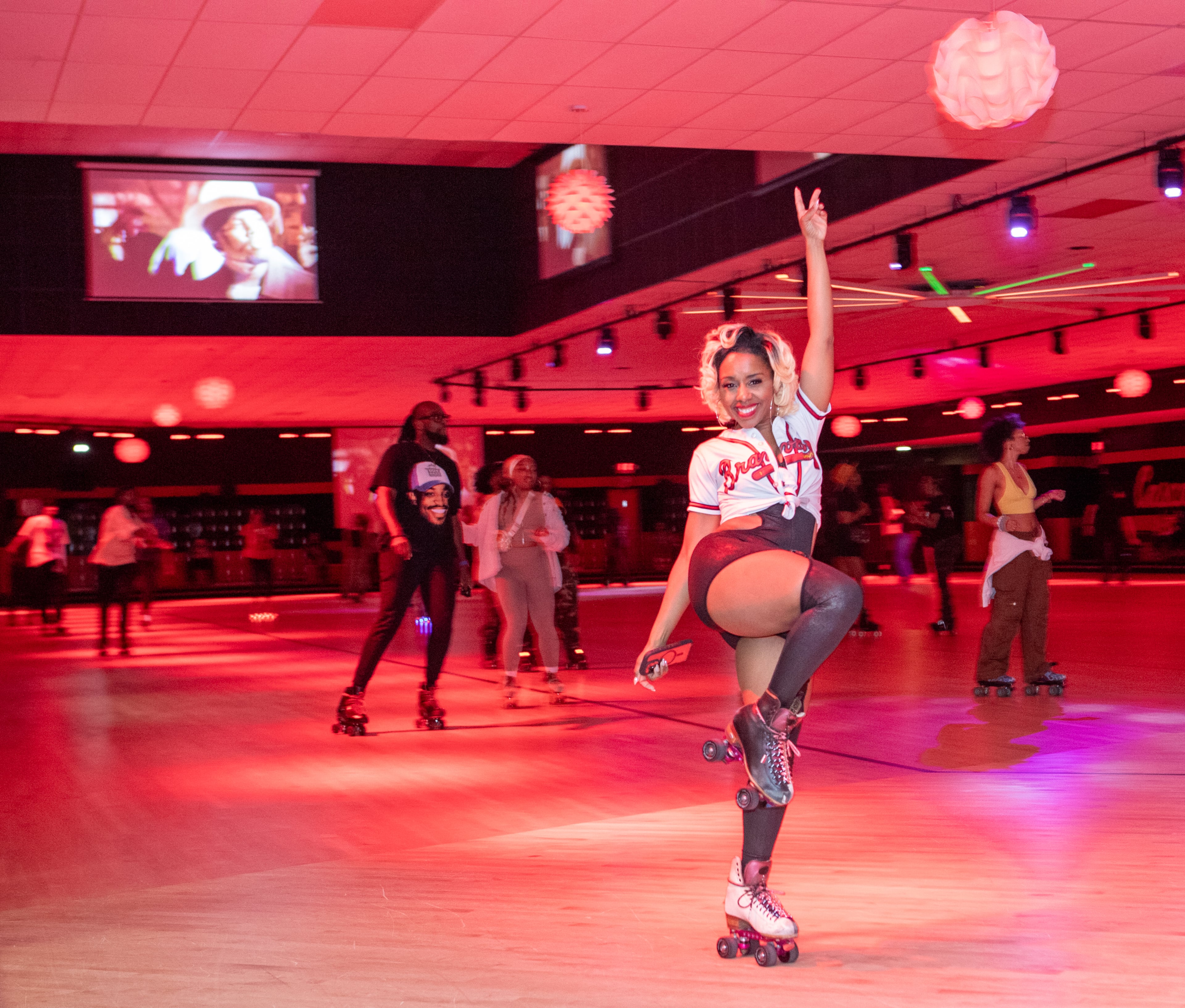 Kamille Gilmore donned skates and enjoyed the celebration of the 25th anniversary of Outkast's "Stankonia" album. (Jenni Girtman for the AJC)