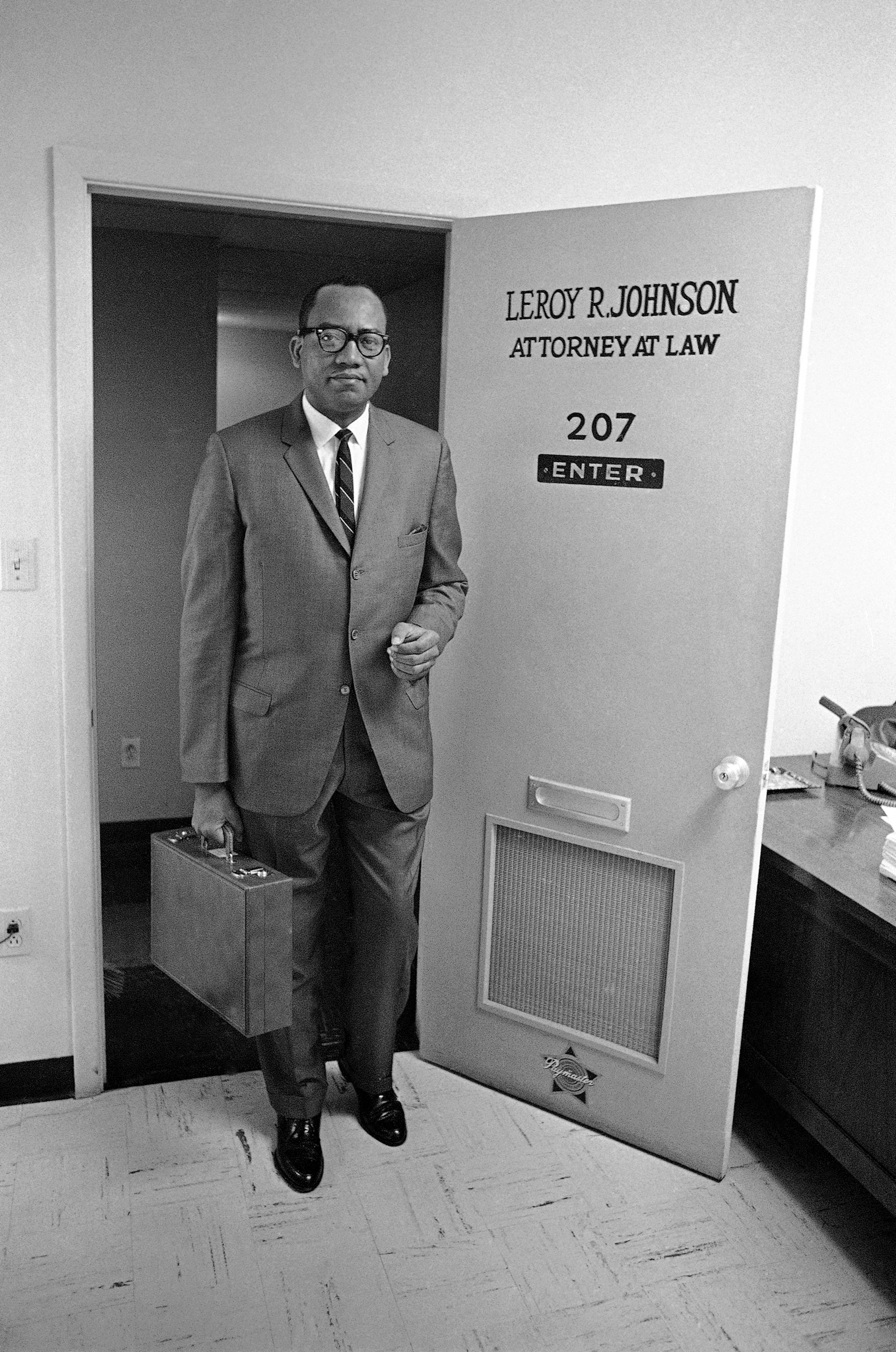 Leroy R. Johnson, Georgia's first African-American in the state Senate in 92 years, poses on March 26, 1963, at the door of his office in Atlanta. The 34-year-old attorney predicted that the racial fence around the state Democratic Party would fall under the weight of African-American ballots. (The Associated Press)