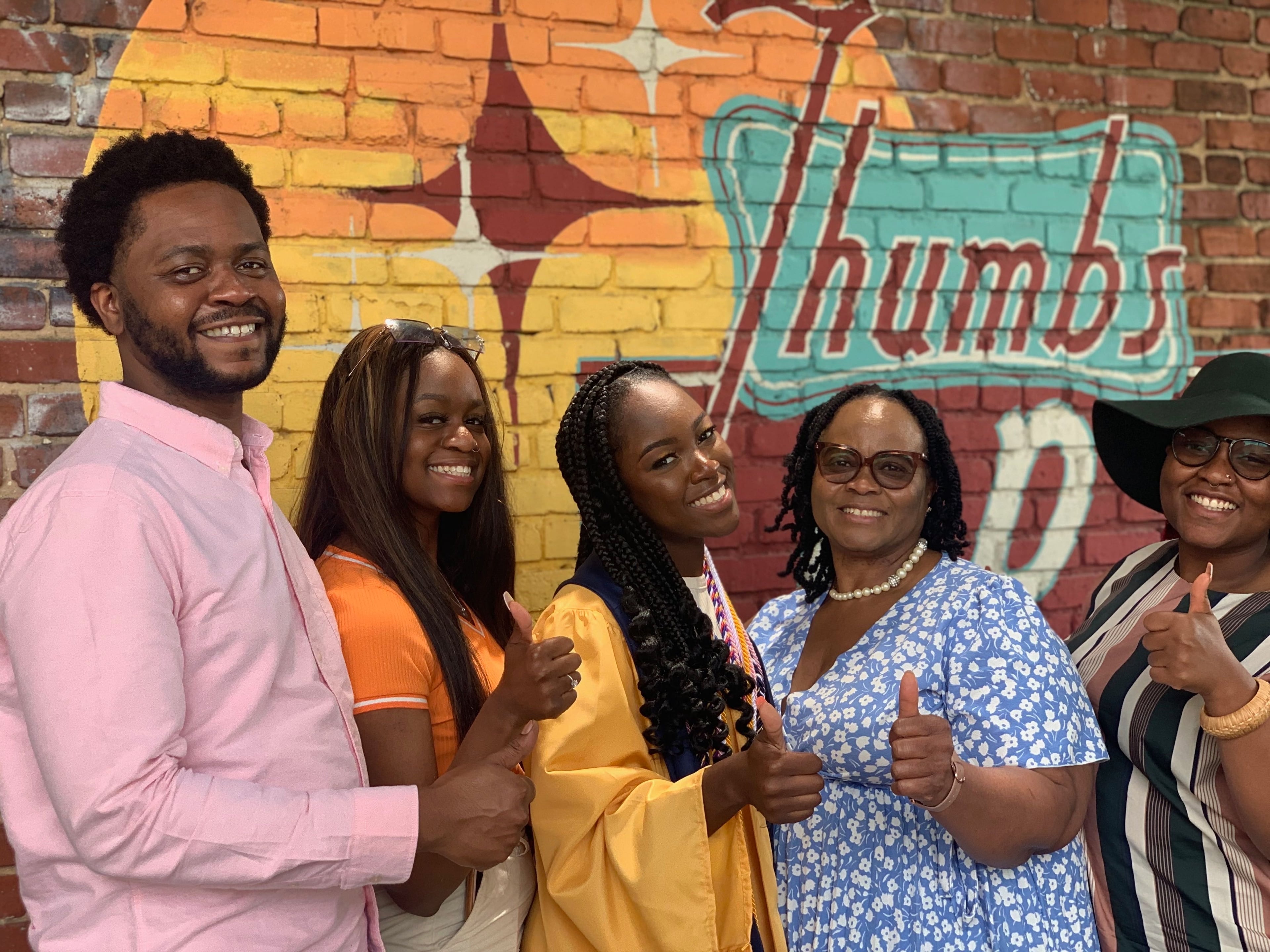 FAMU's first woman head drum major Oluwamodupe "Dupe" Oloyede stands with her family at her high school graduation in 2021. From L-R: Brother Babajide, sister Joy, Dupe, mother Edith, sister Stella. (Courtesy of Stella Oloye)